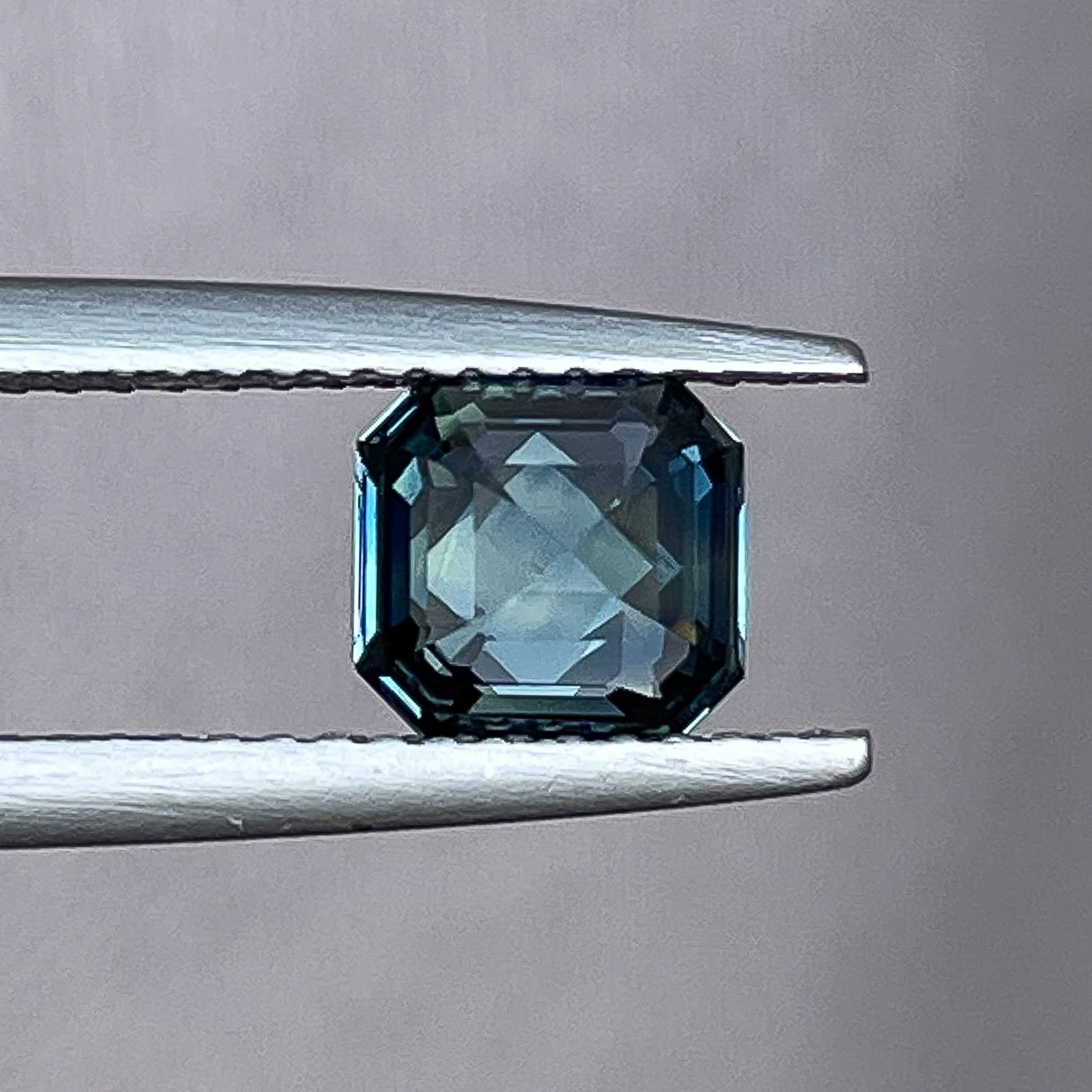 Natural teal blue sapphire 1.52 Ct emerald cut loose gemstone from NASHGEMS, ideal for engagement rings or custom jewelry.