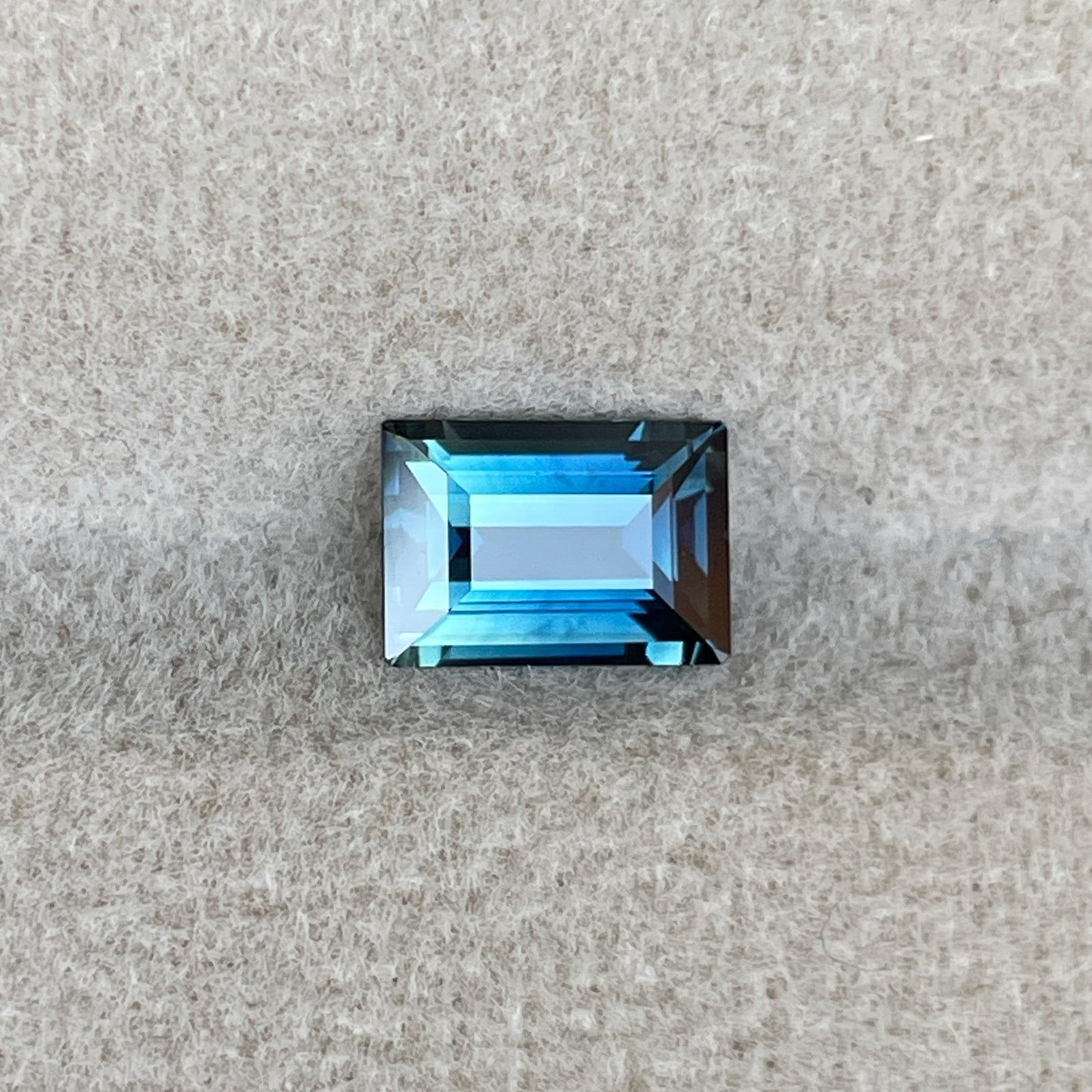 Teal blue sapphire 1.15 ct loose gemstone in princess cut, ideal for engagement rings or custom jewelry by NASHGEMS.