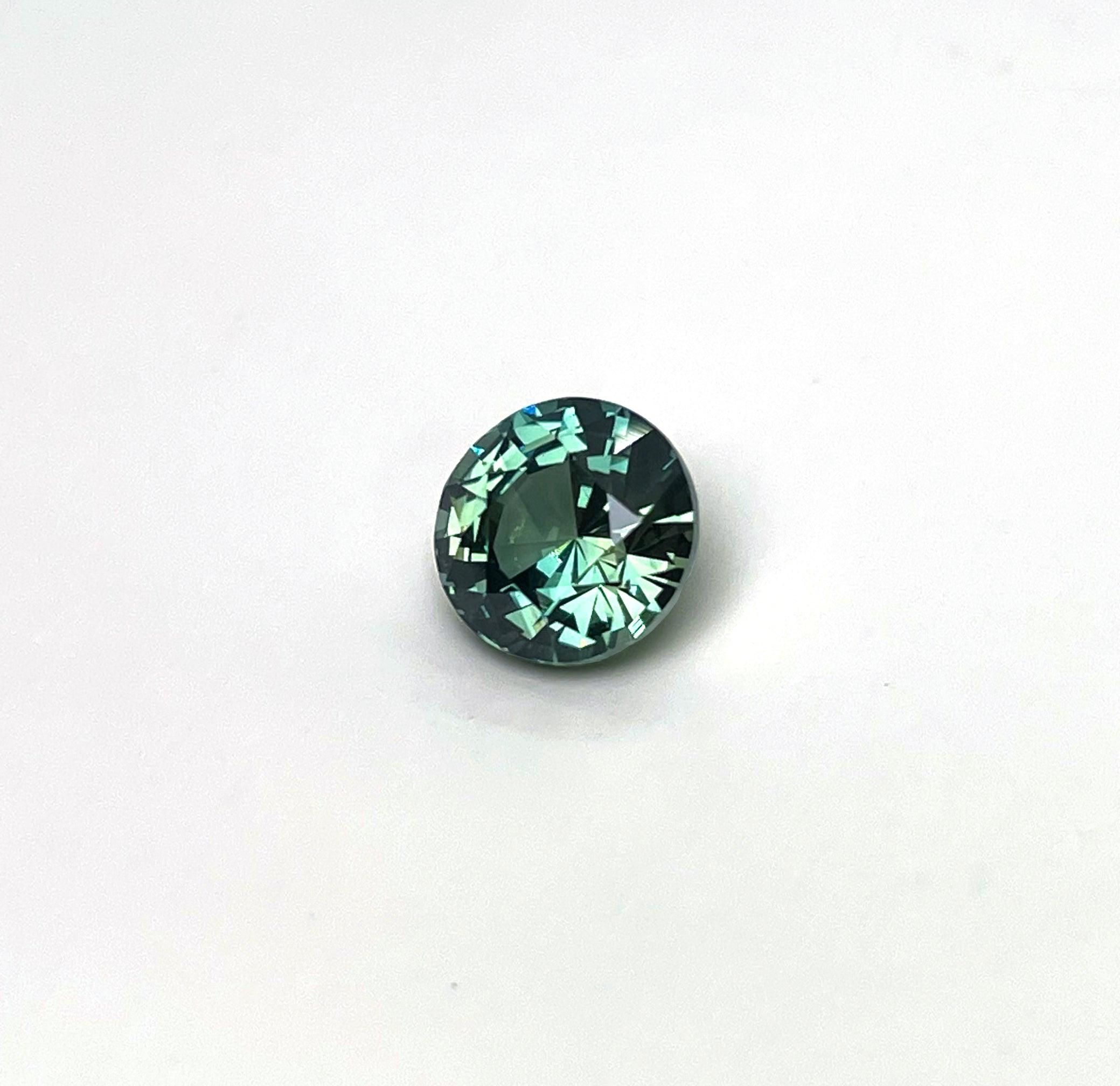 2.22 carat Teal/ Parti Sapphire is well cut to bring out the best colour and luster,