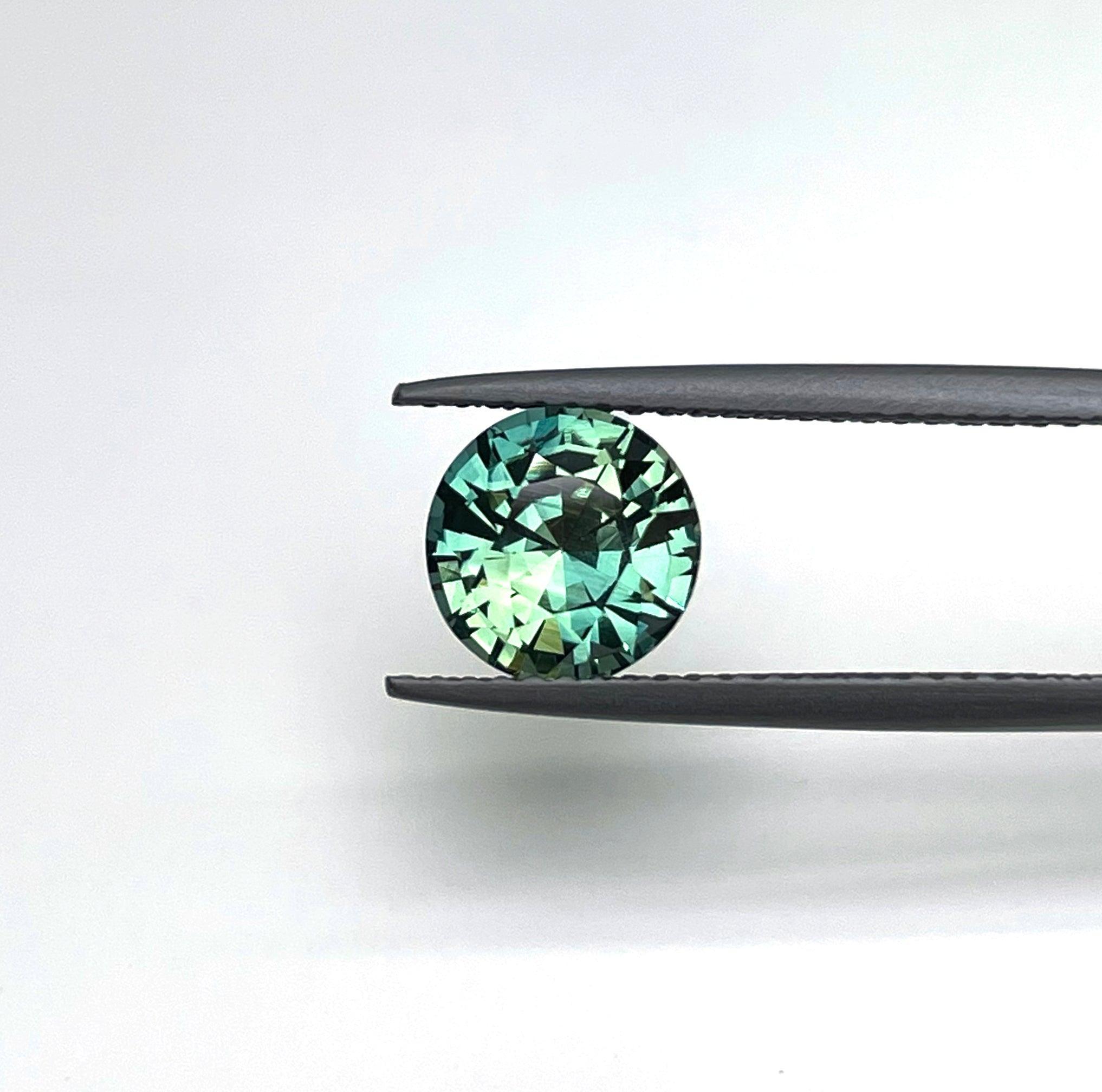 2.22 carat Teal/ Parti Sapphire is well cut to bring out the best colour and luster,