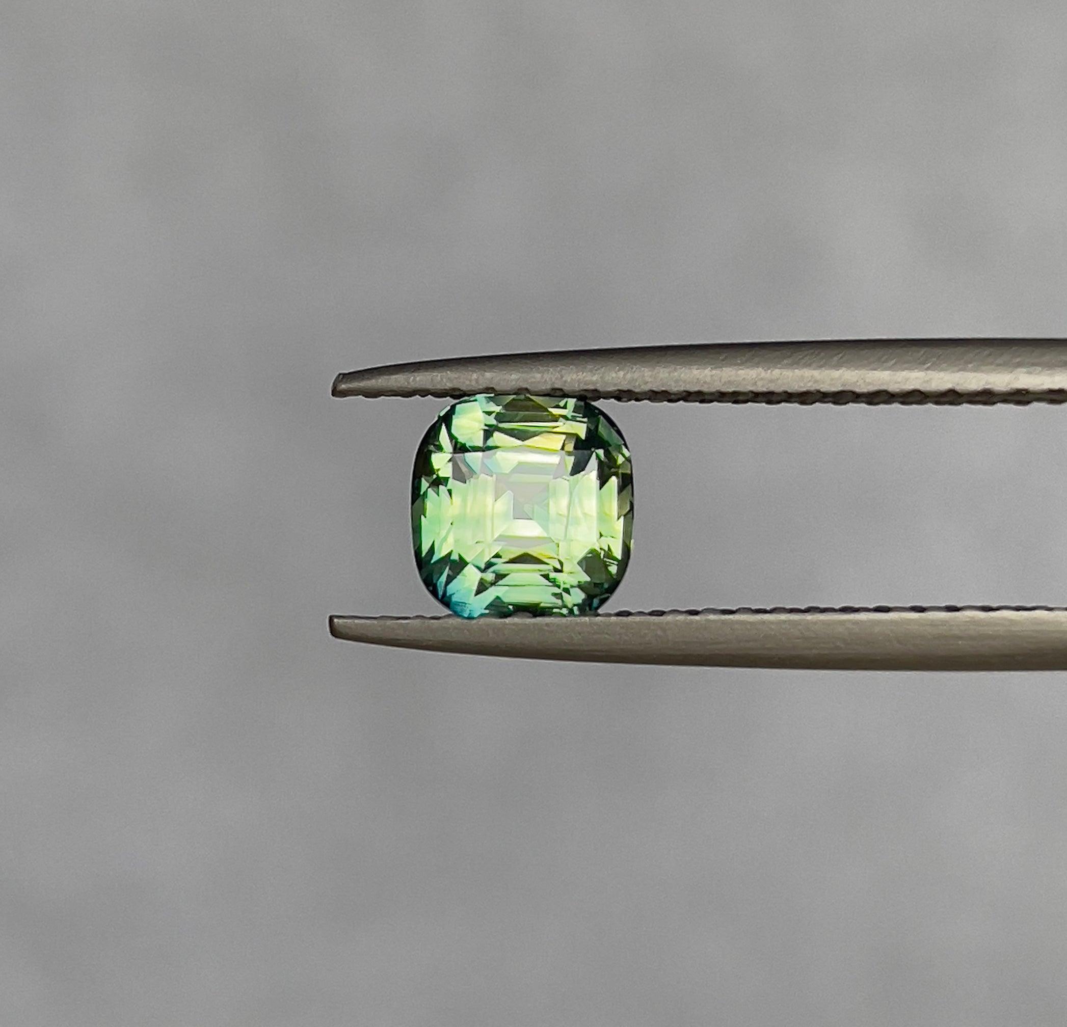 teal blue green parti sapphire cushion cut gem