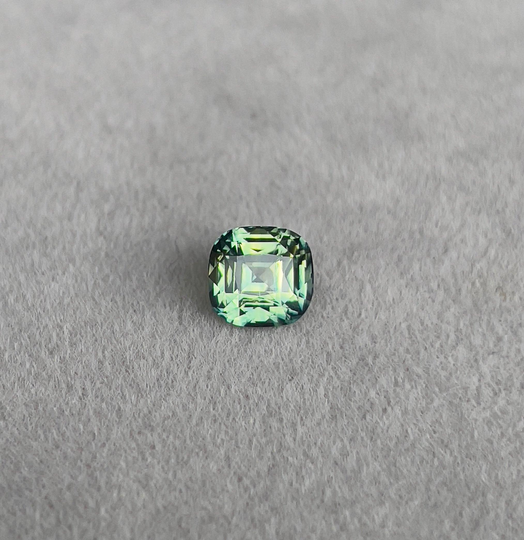 teal blue green parti sapphire cushion cut gem