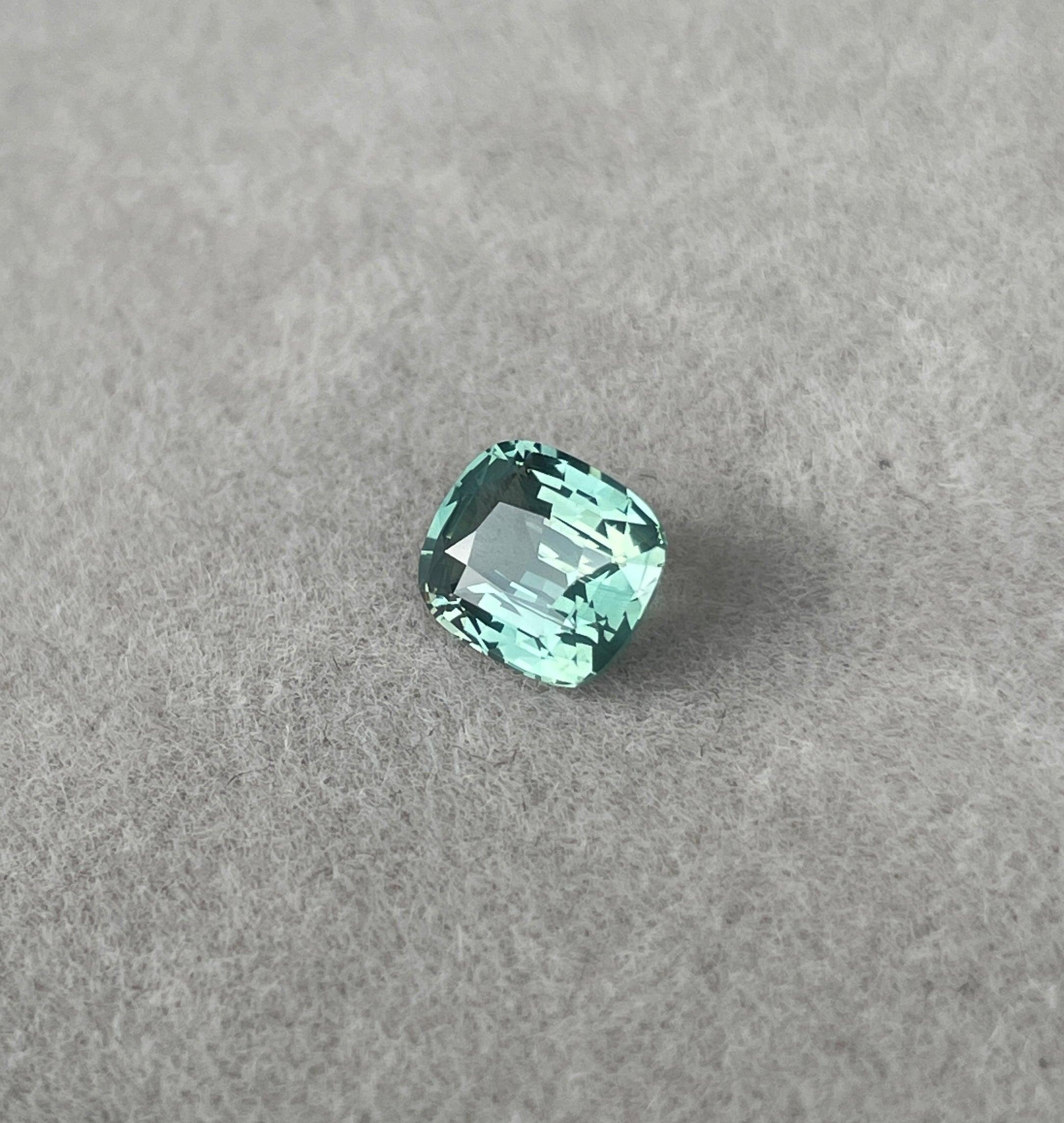 teal blue green parti sapphire cushion cut gem