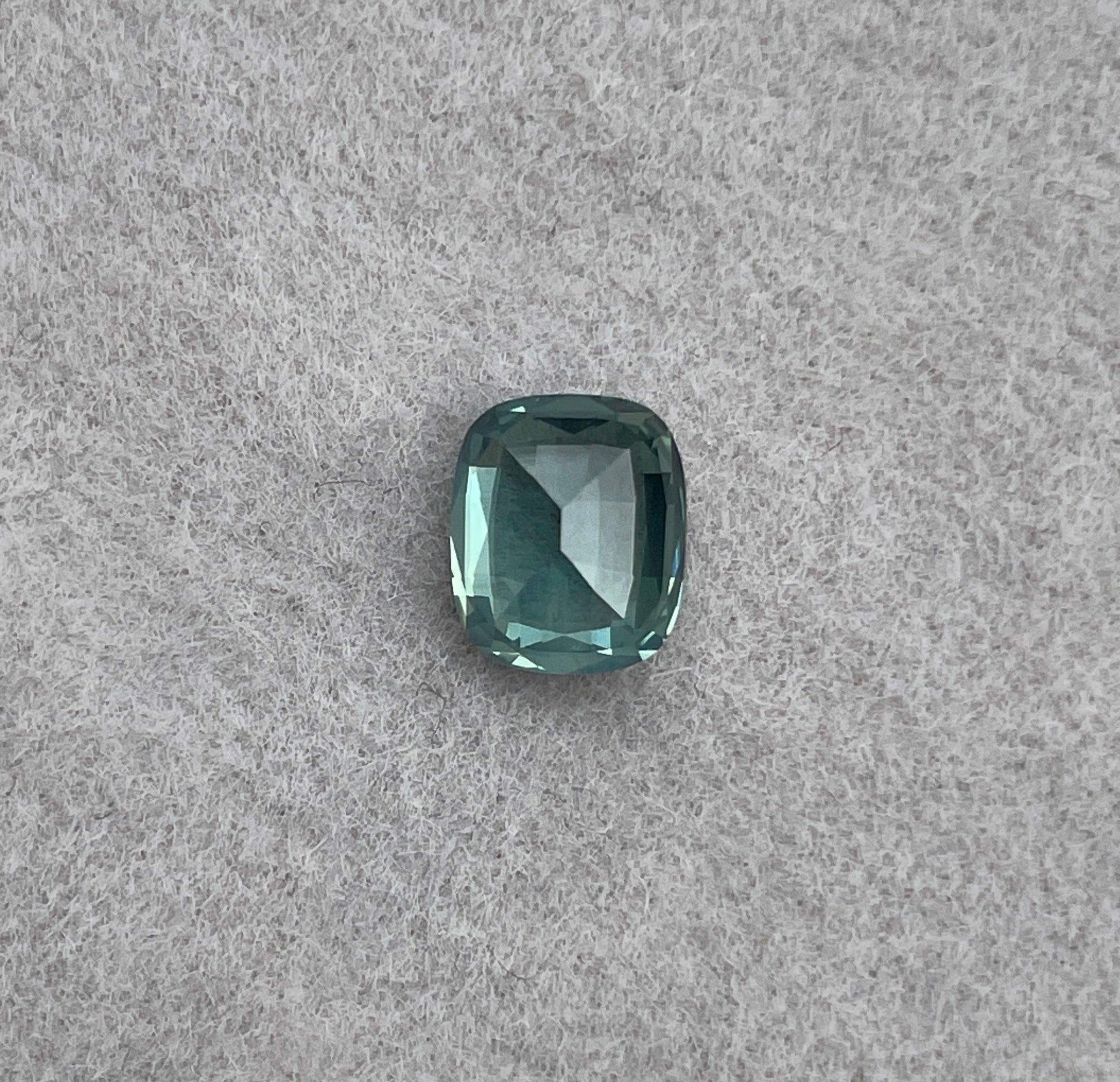 teal blue green parti sapphire cushion cut gem