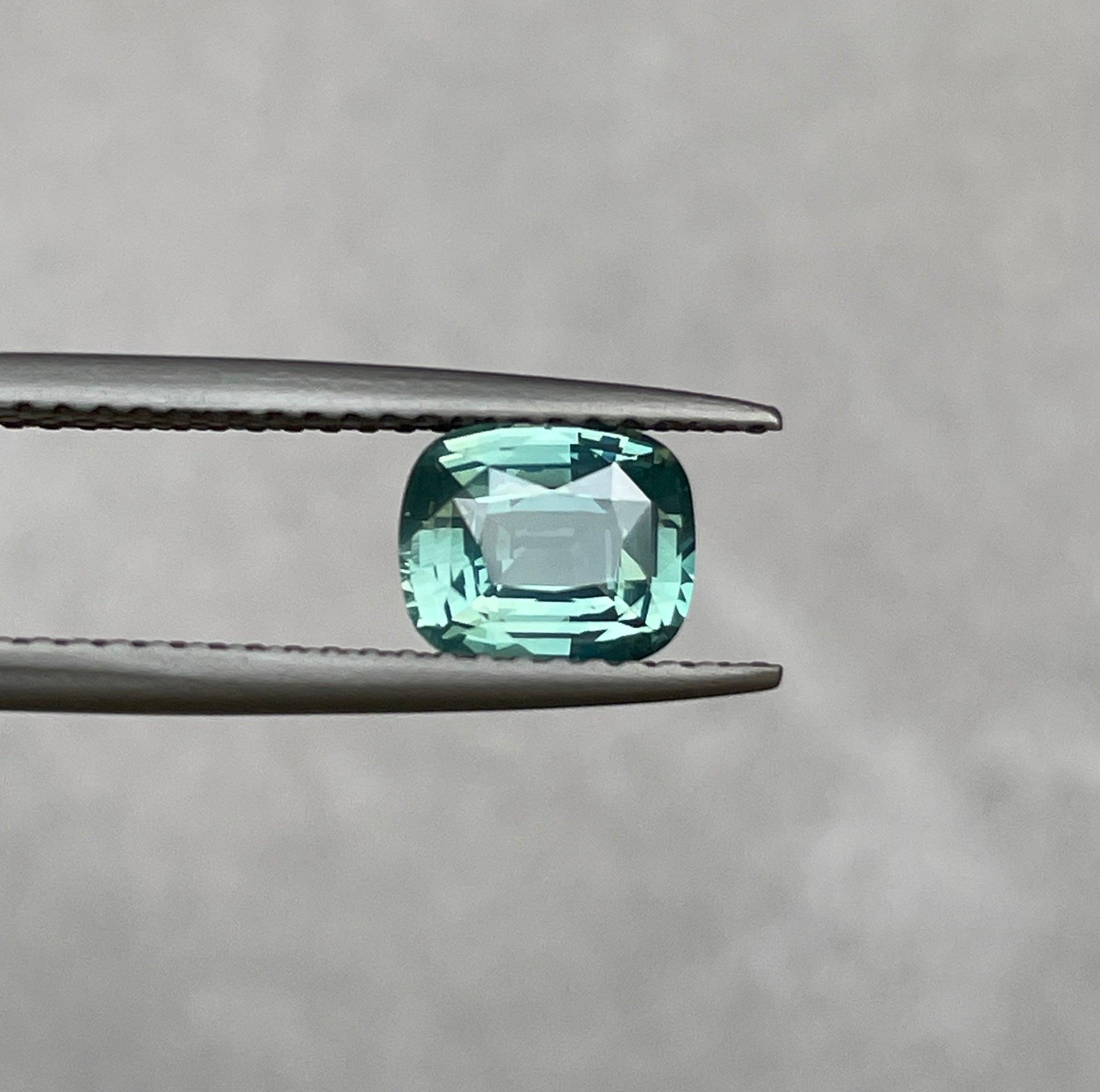 teal blue green parti sapphire cushion cut gem