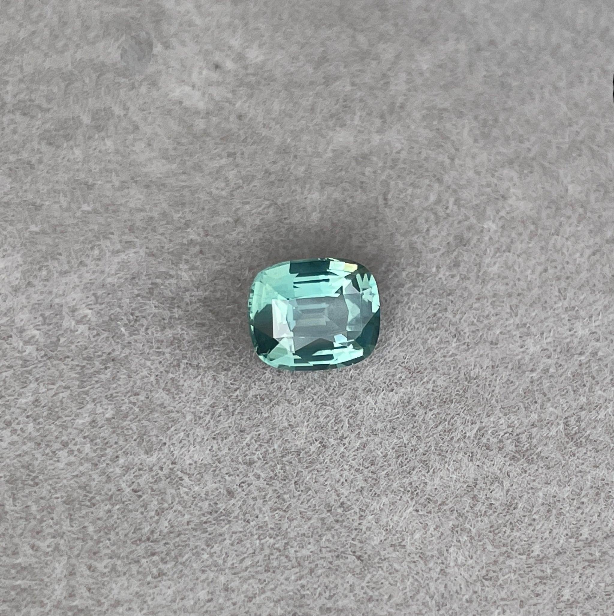 teal blue green parti sapphire cushion cut gem