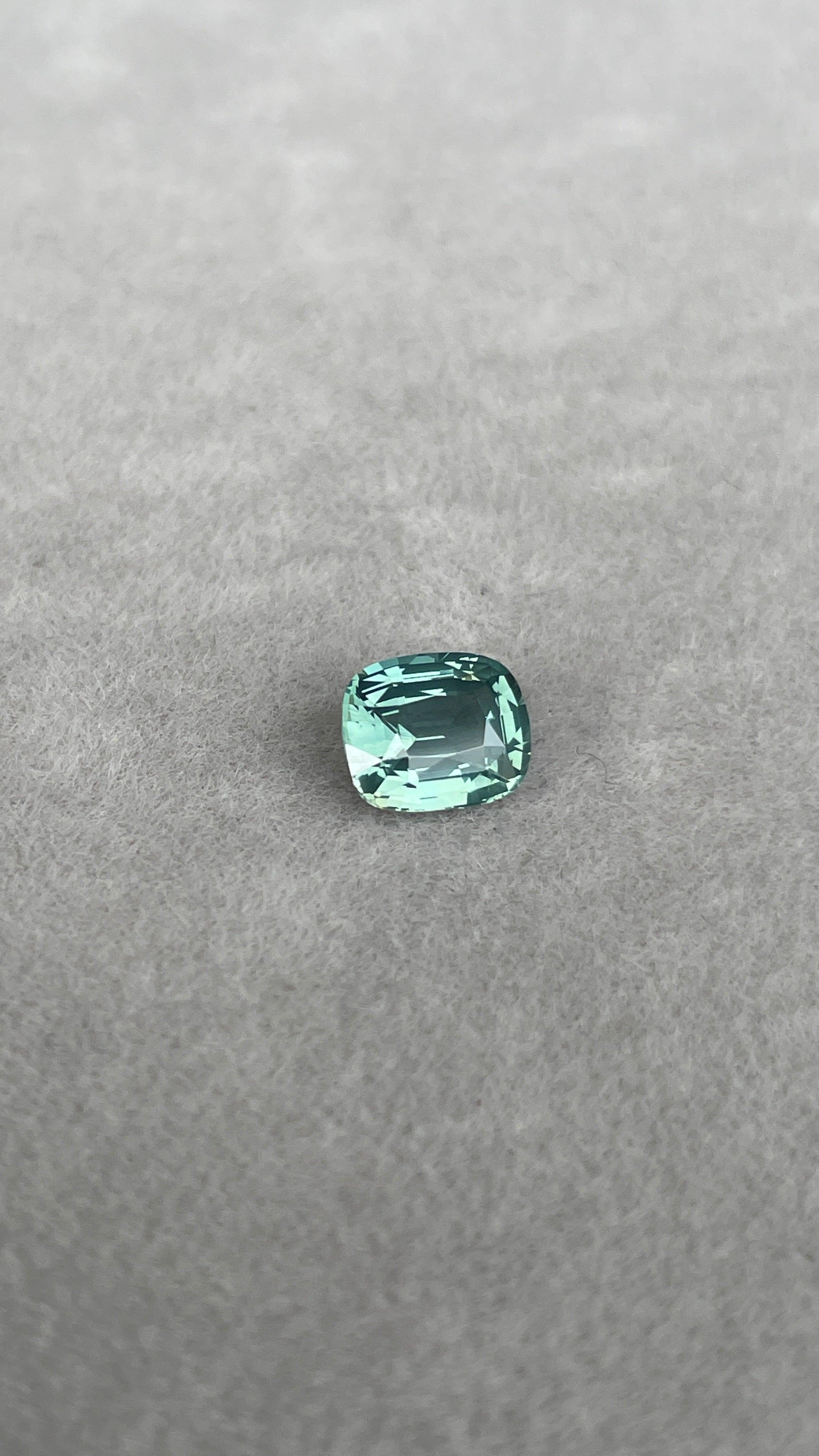 teal blue green parti sapphire cushion cut gem