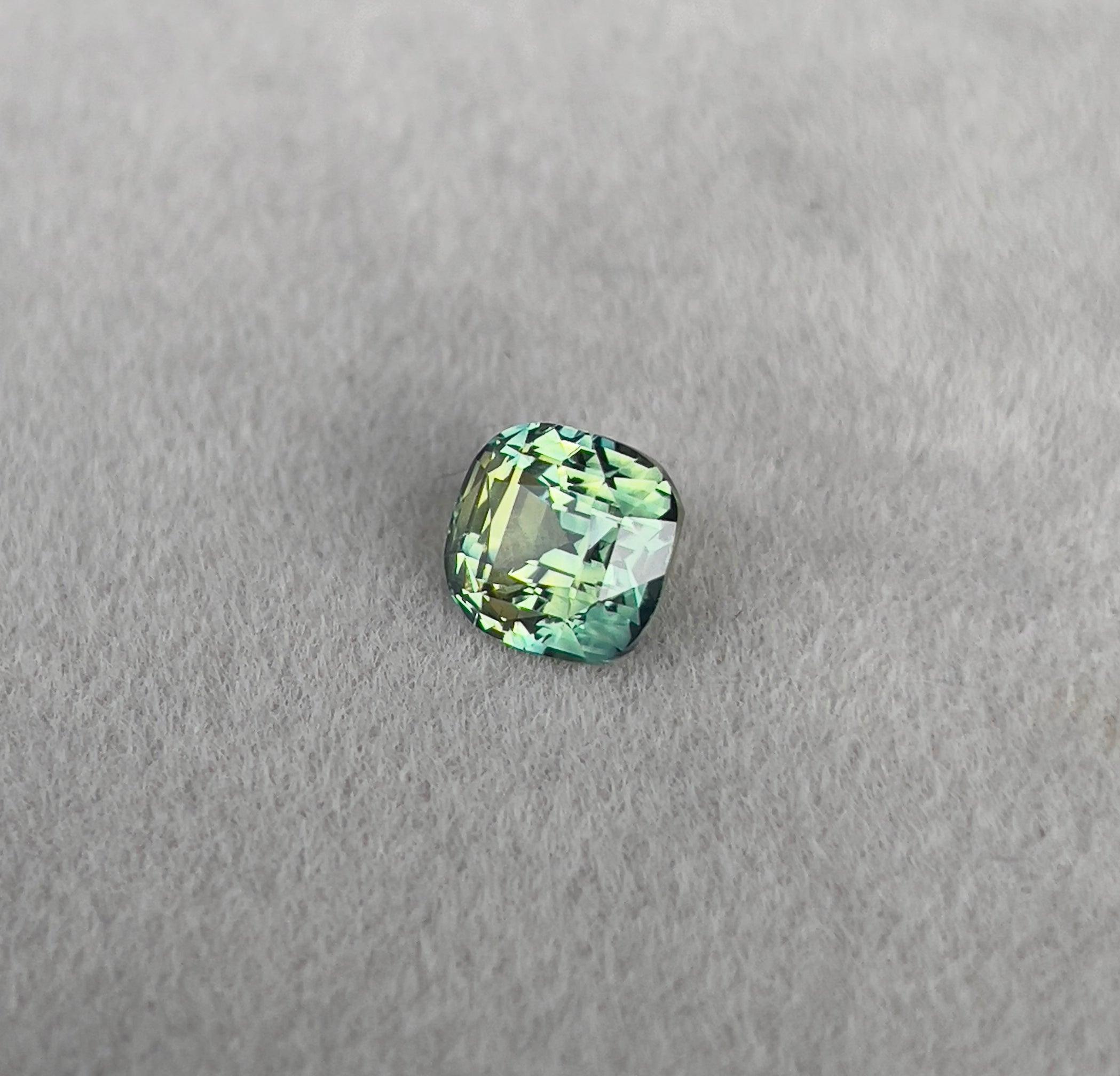 teal blue green parti sapphire cushion cut gem