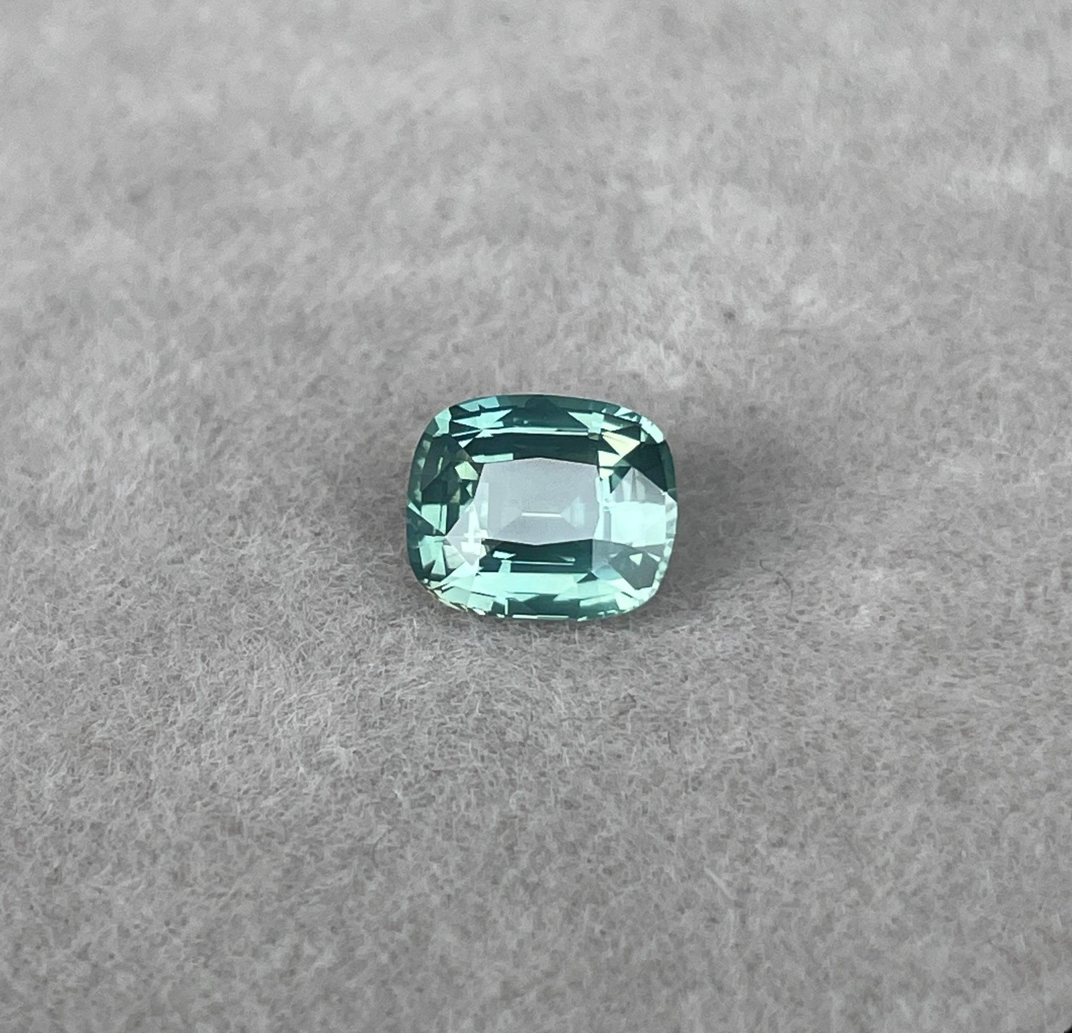 teal blue green parti sapphire cushion cut gem