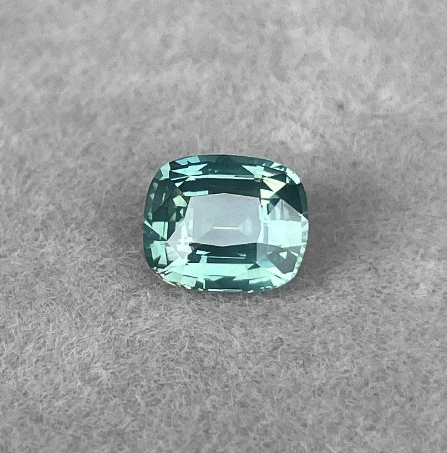teal blue green parti sapphire cushion cut gem