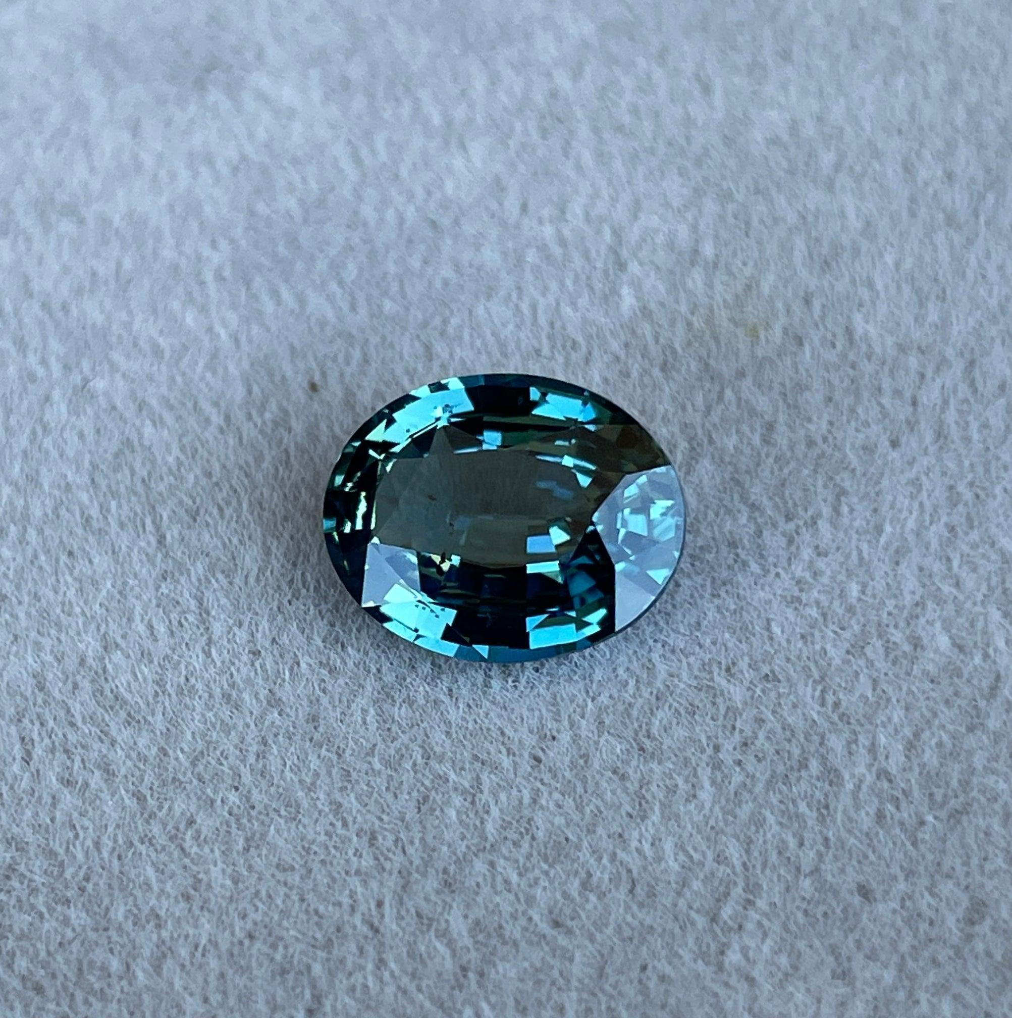 teal blue green parti sapphire oval cut gem