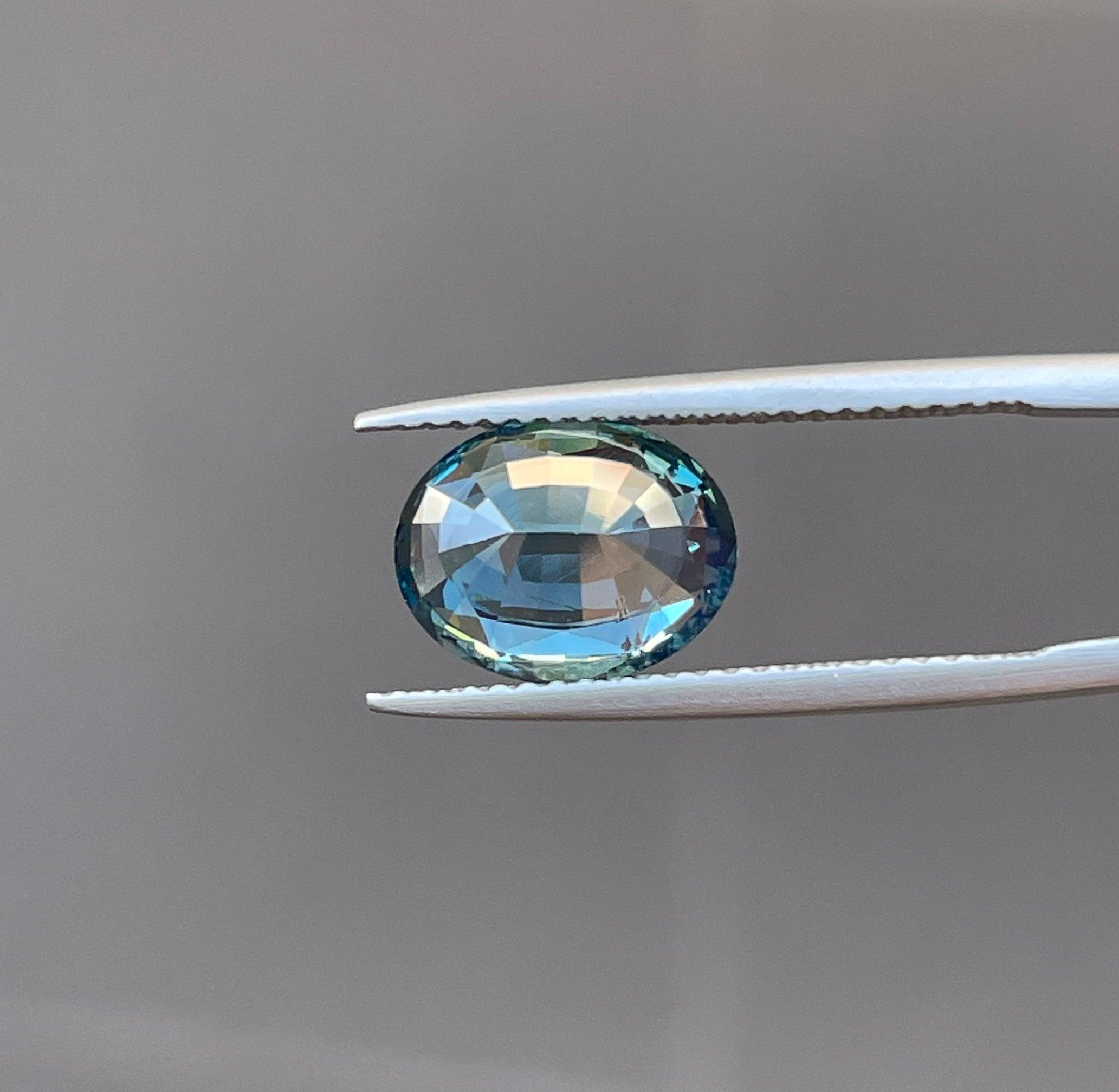 teal blue green parti sapphire oval cut gem