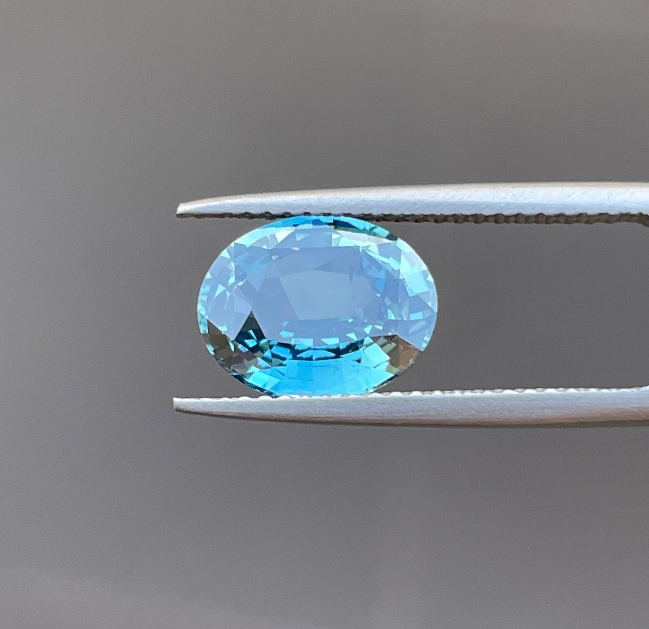 teal blue green parti sapphire oval cut gem