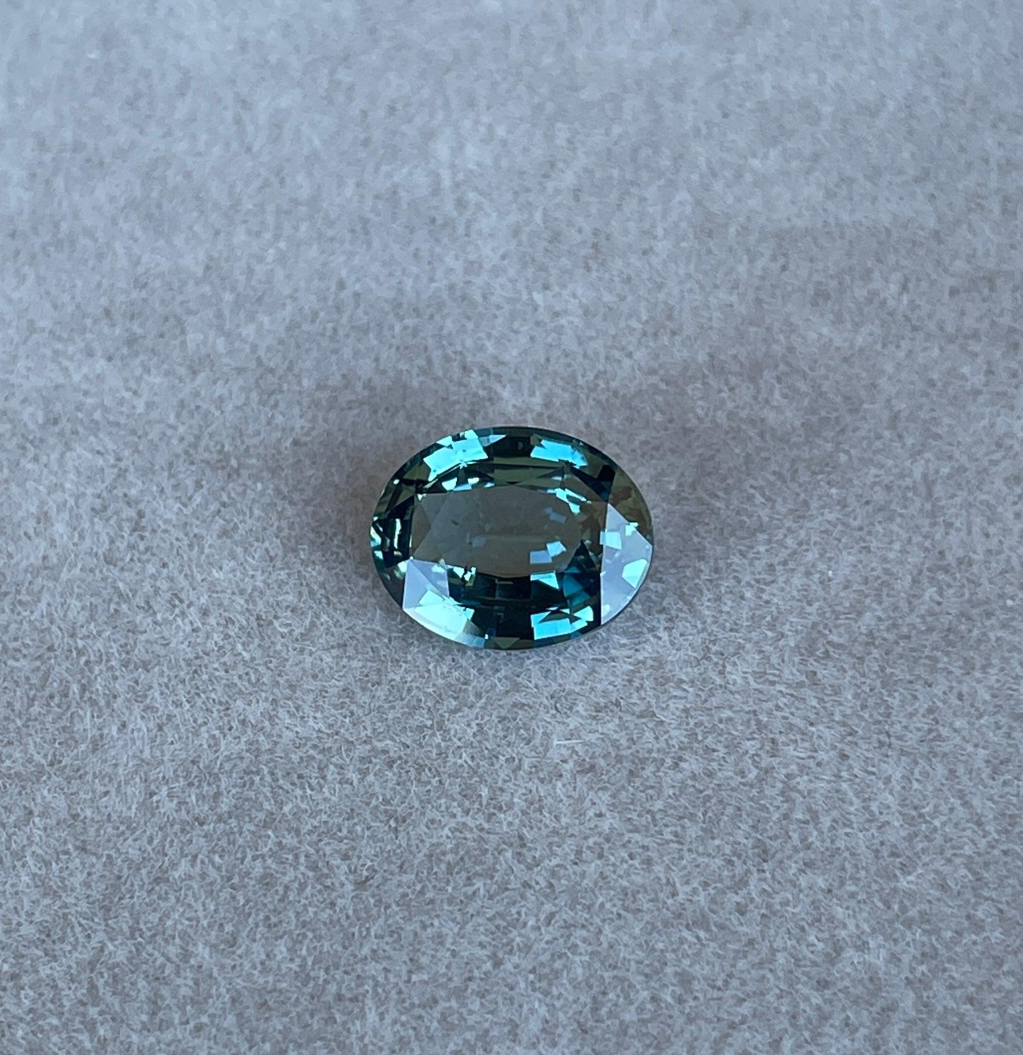 teal blue green parti sapphire oval cut gem