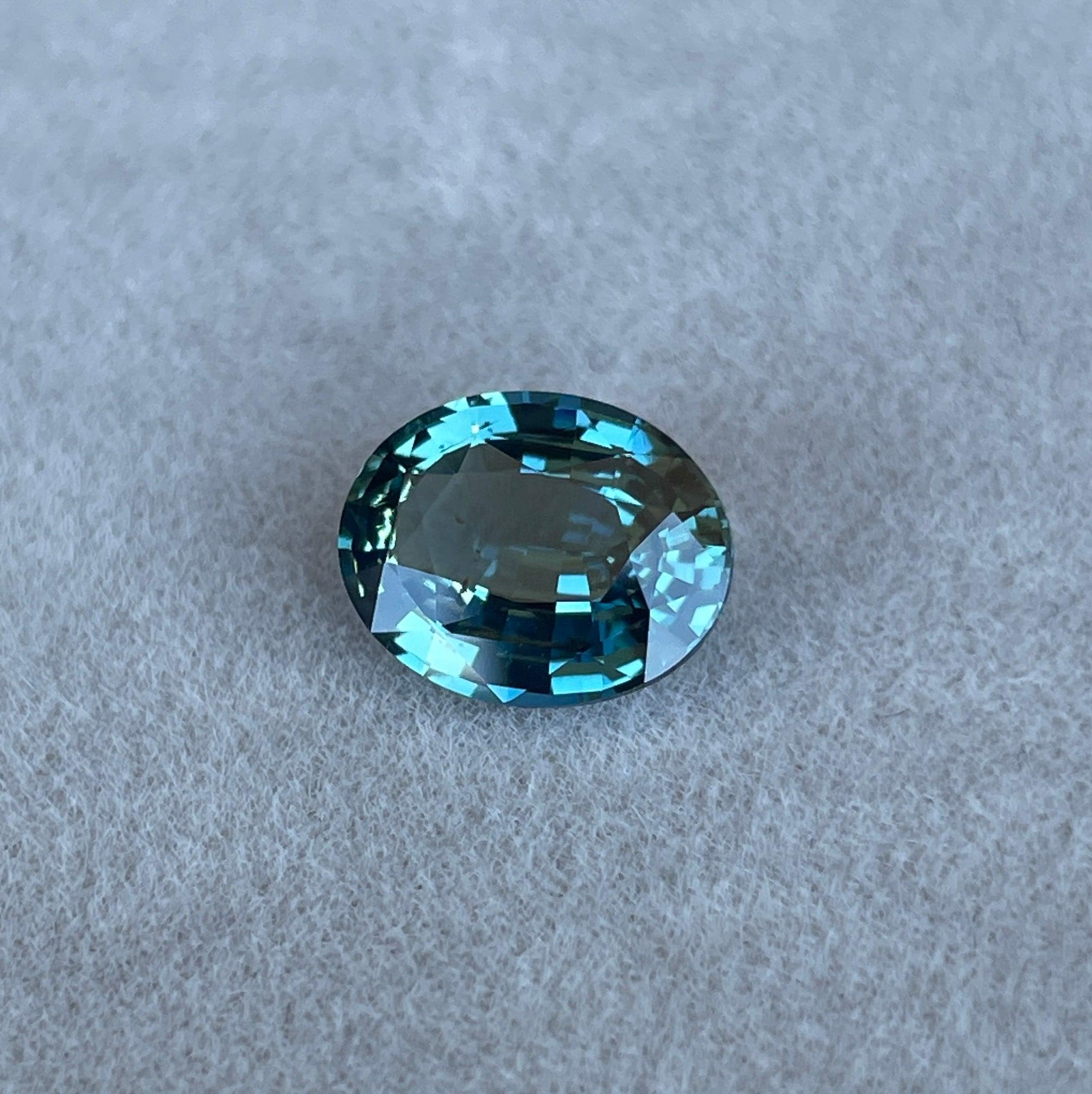 teal blue green parti sapphire oval cut gem