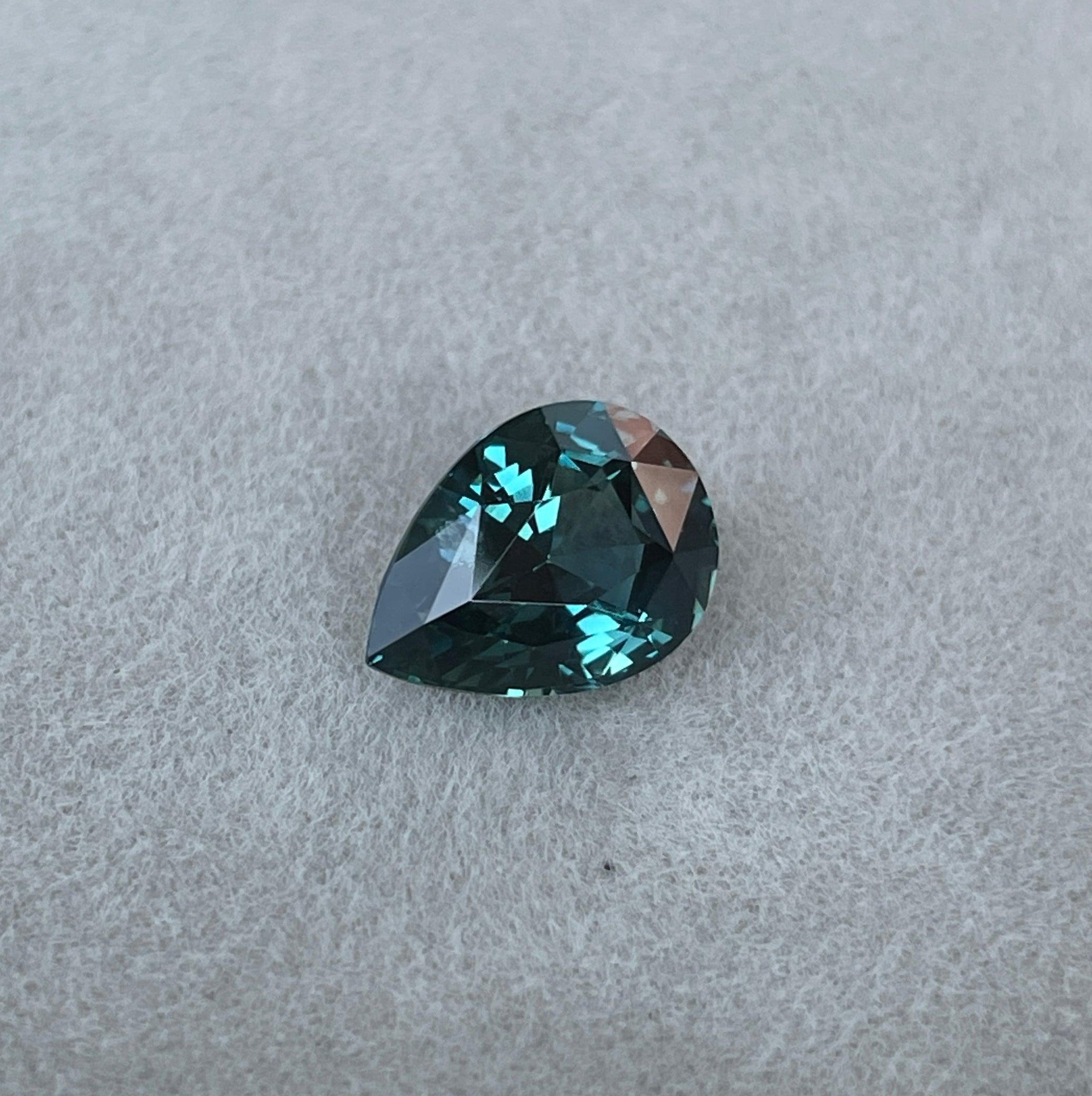 teal blue green parti sapphire pear drop cut gem