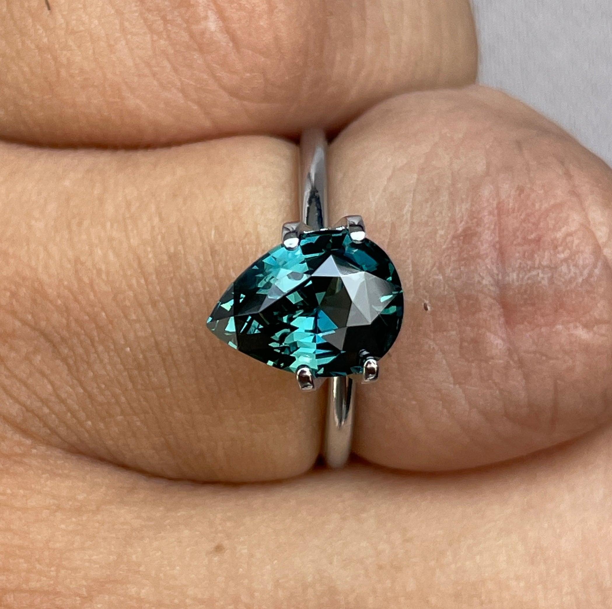 teal blue green parti sapphire pear drop cut gem