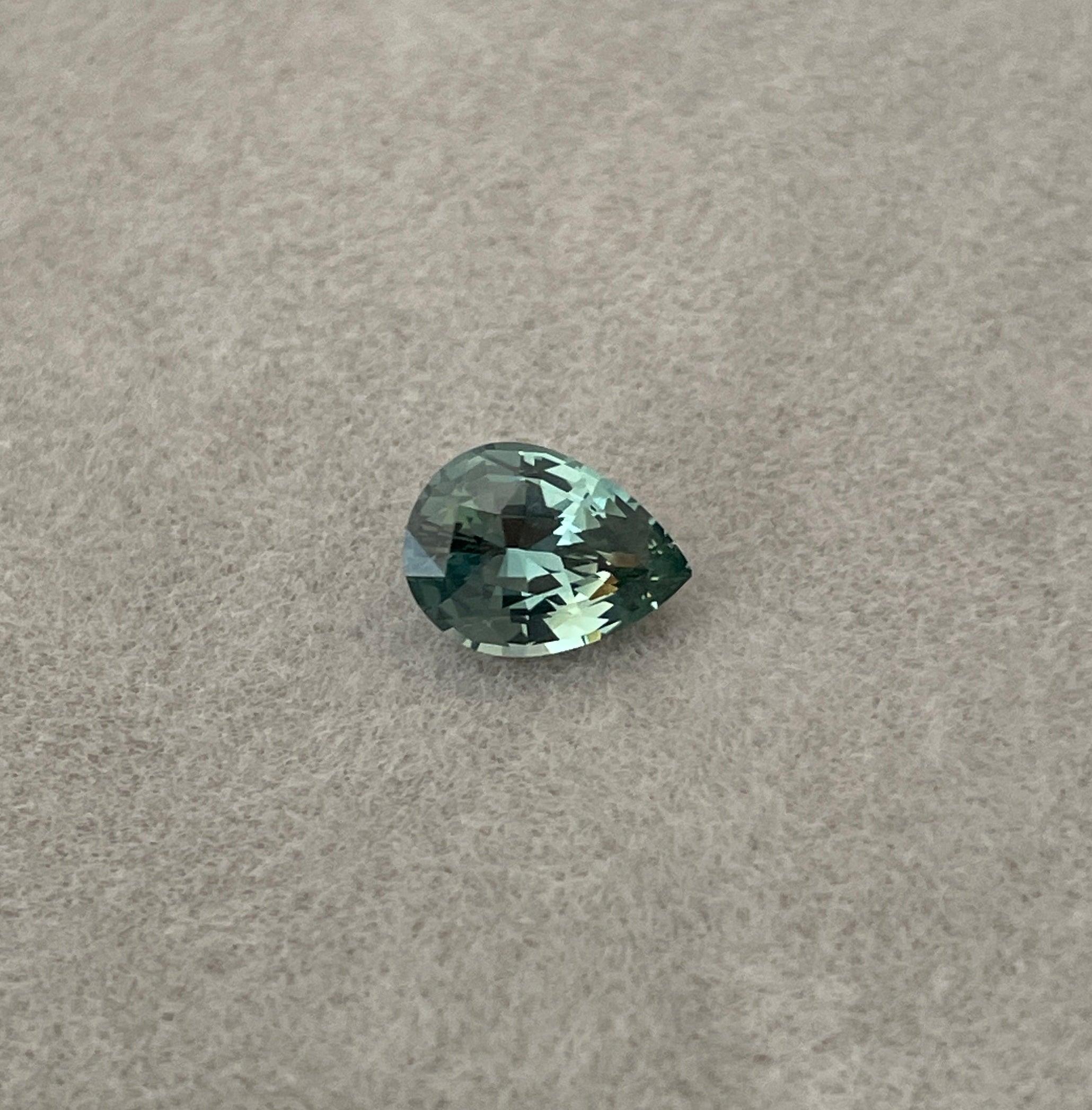 teal blue green parti sapphire pear drop cut gem