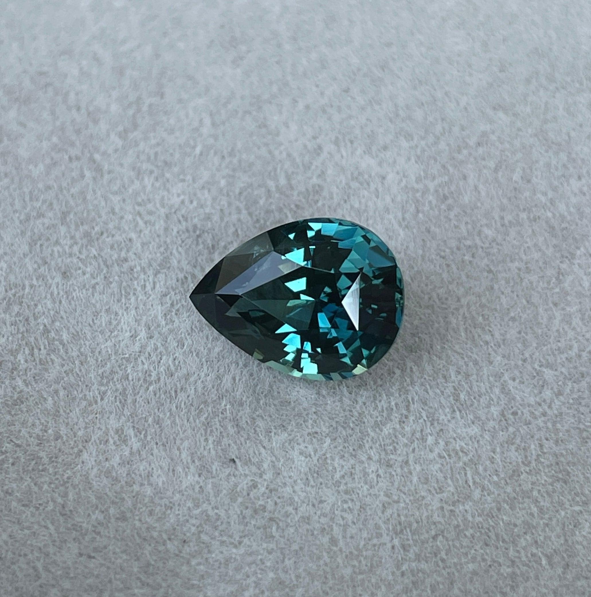 teal blue green parti sapphire pear drop cut gem