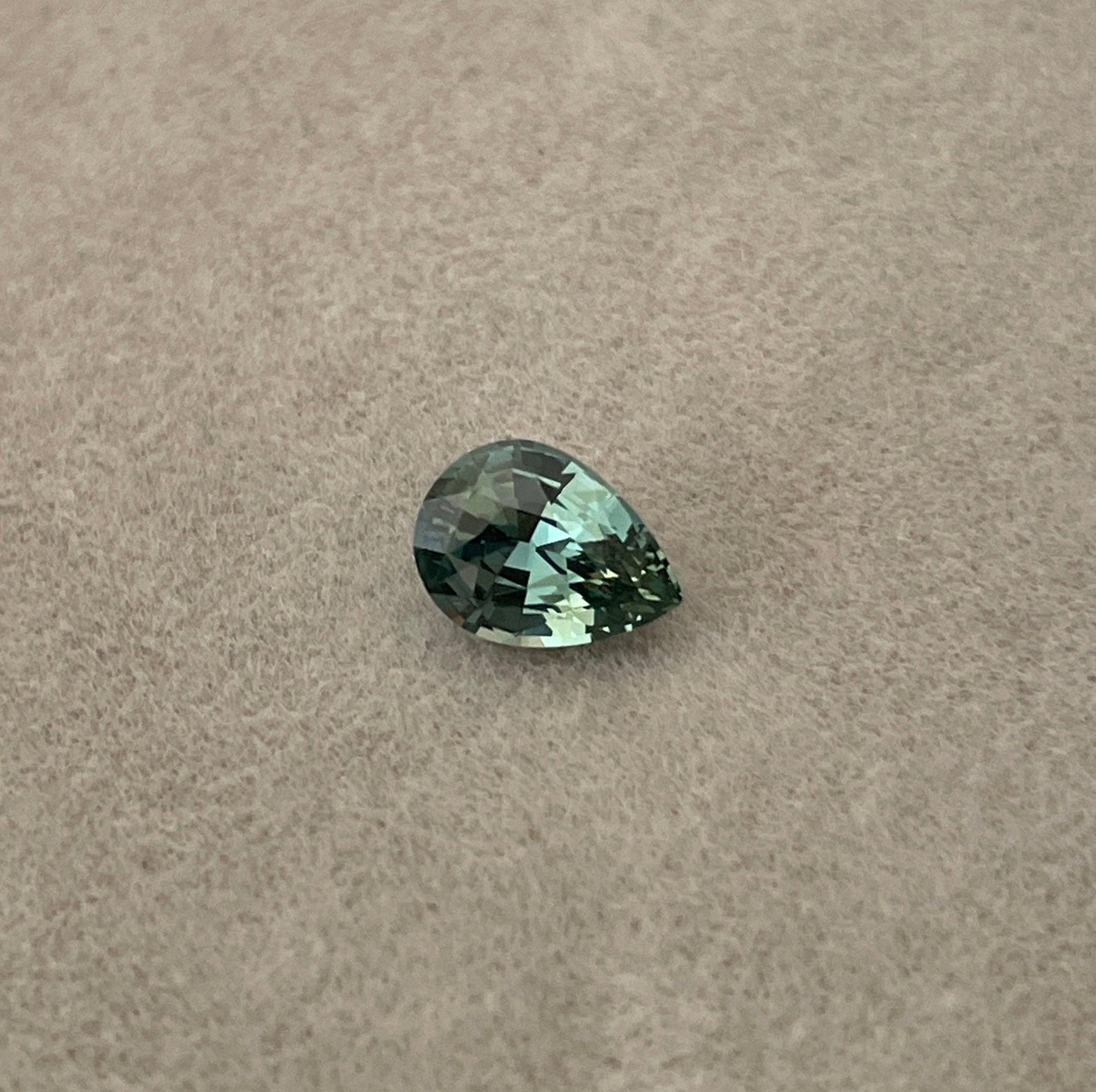 teal blue green parti sapphire pear drop cut gem