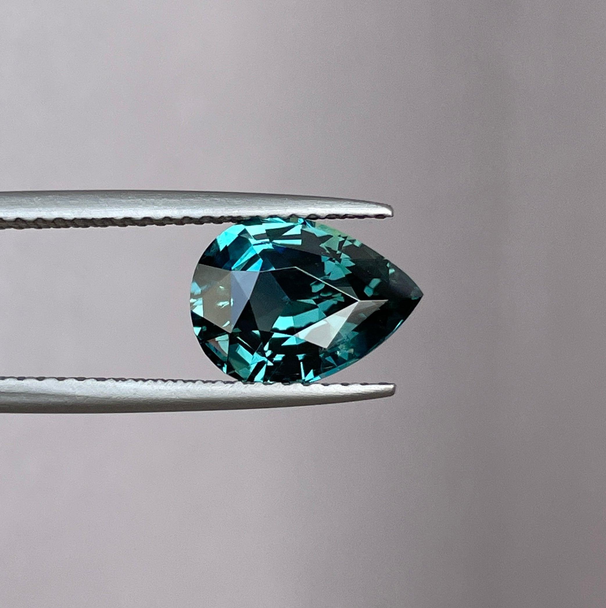 teal blue green parti sapphire pear drop cut gem