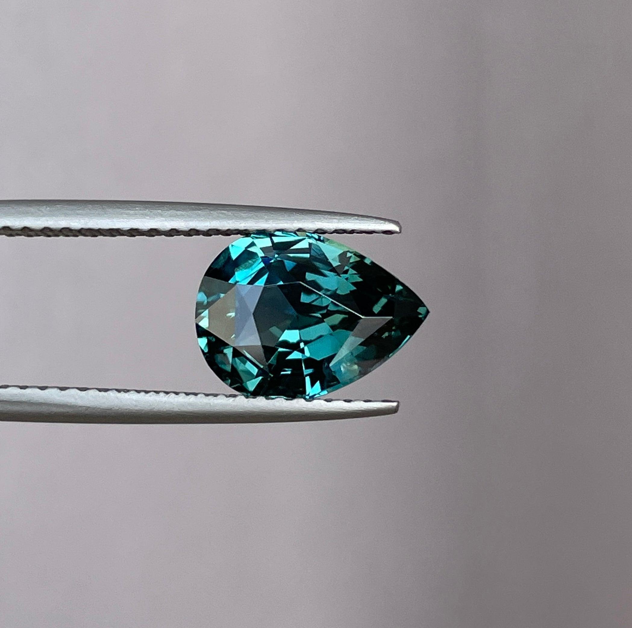 teal blue green parti sapphire pear drop cut gem