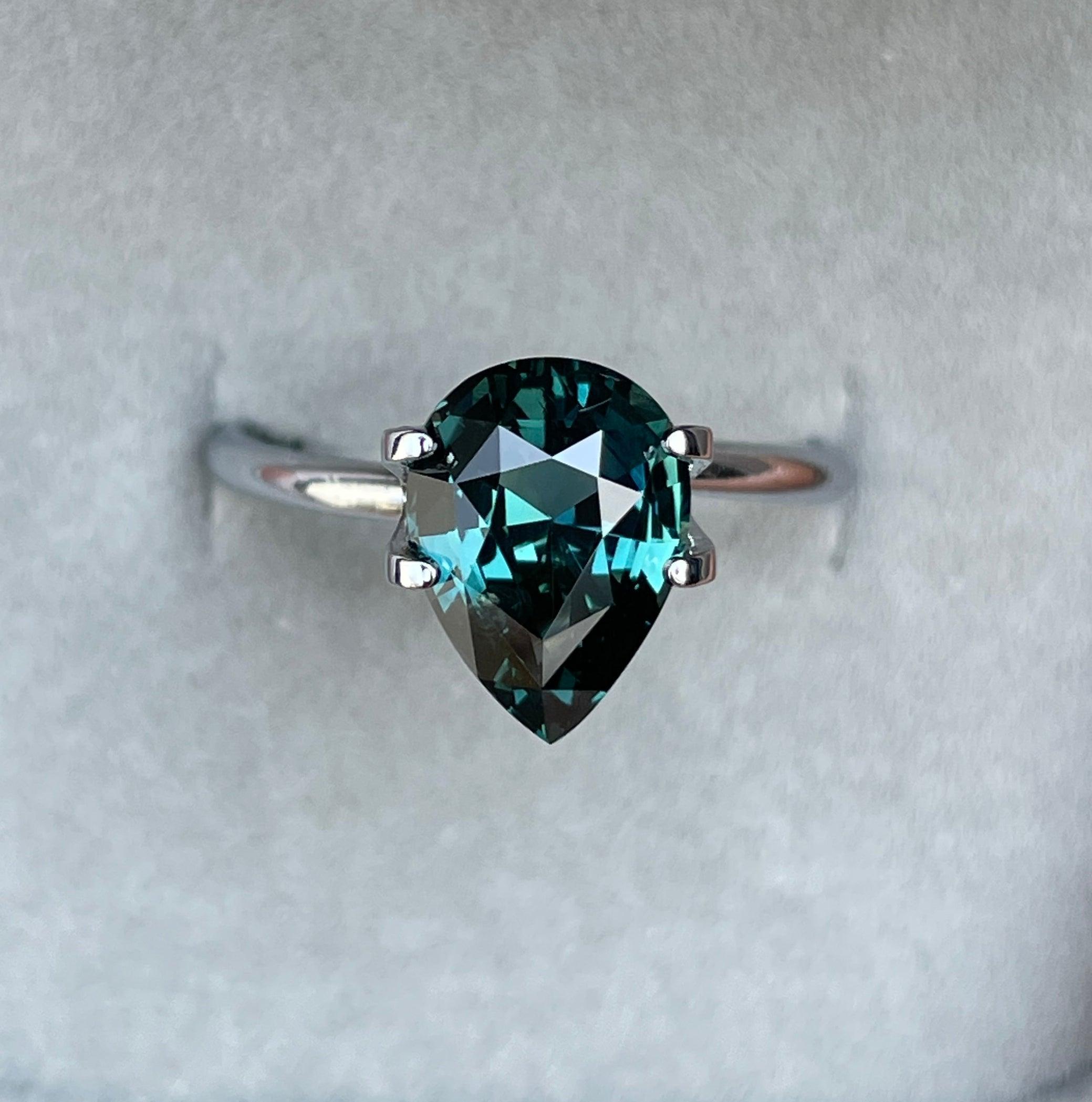 teal blue green parti sapphire pear drop cut gem