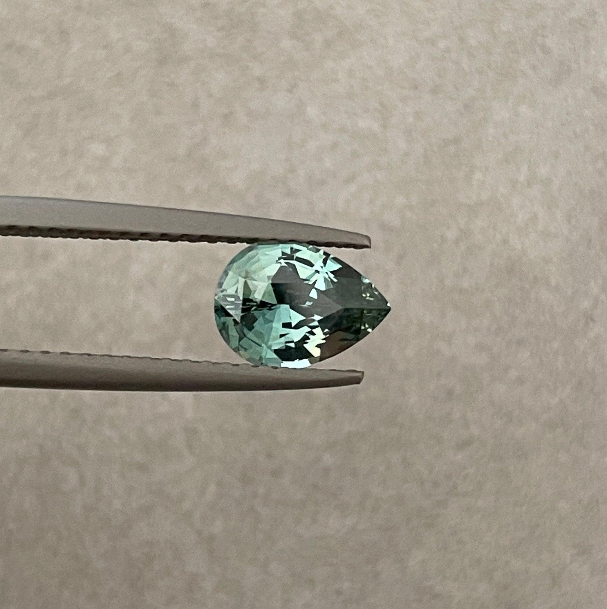teal blue green parti sapphire pear drop cut gem