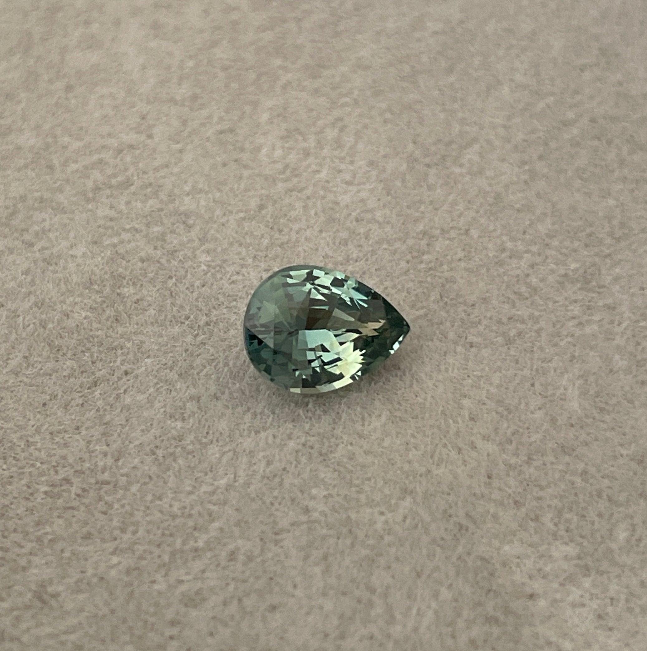 teal blue green parti sapphire pear drop cut gem