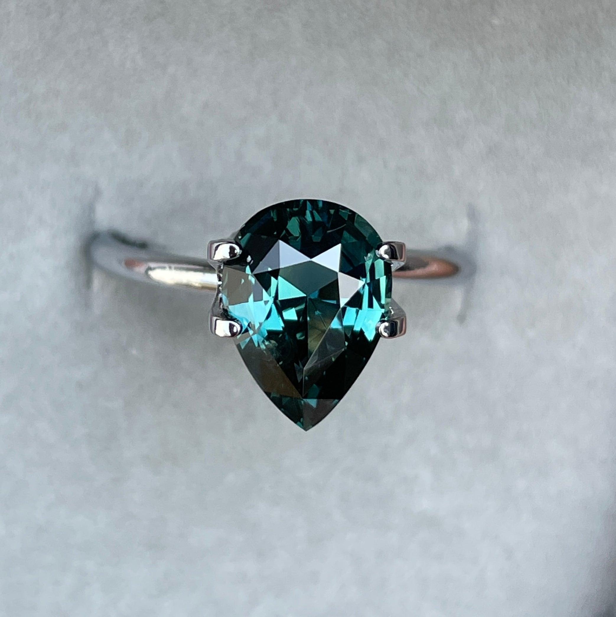 teal blue green parti sapphire pear drop cut gem