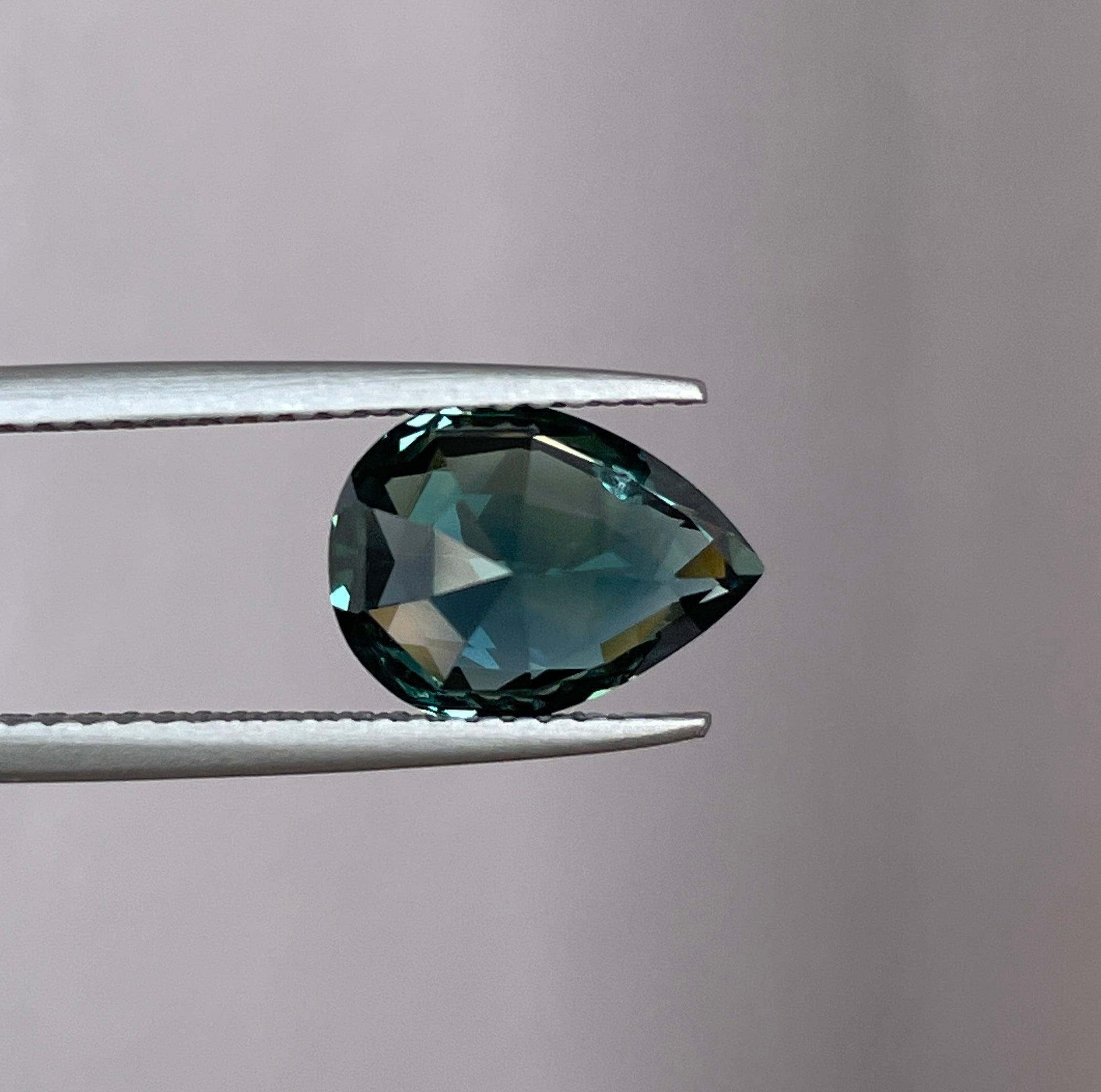 teal blue green parti sapphire pear drop cut gem
