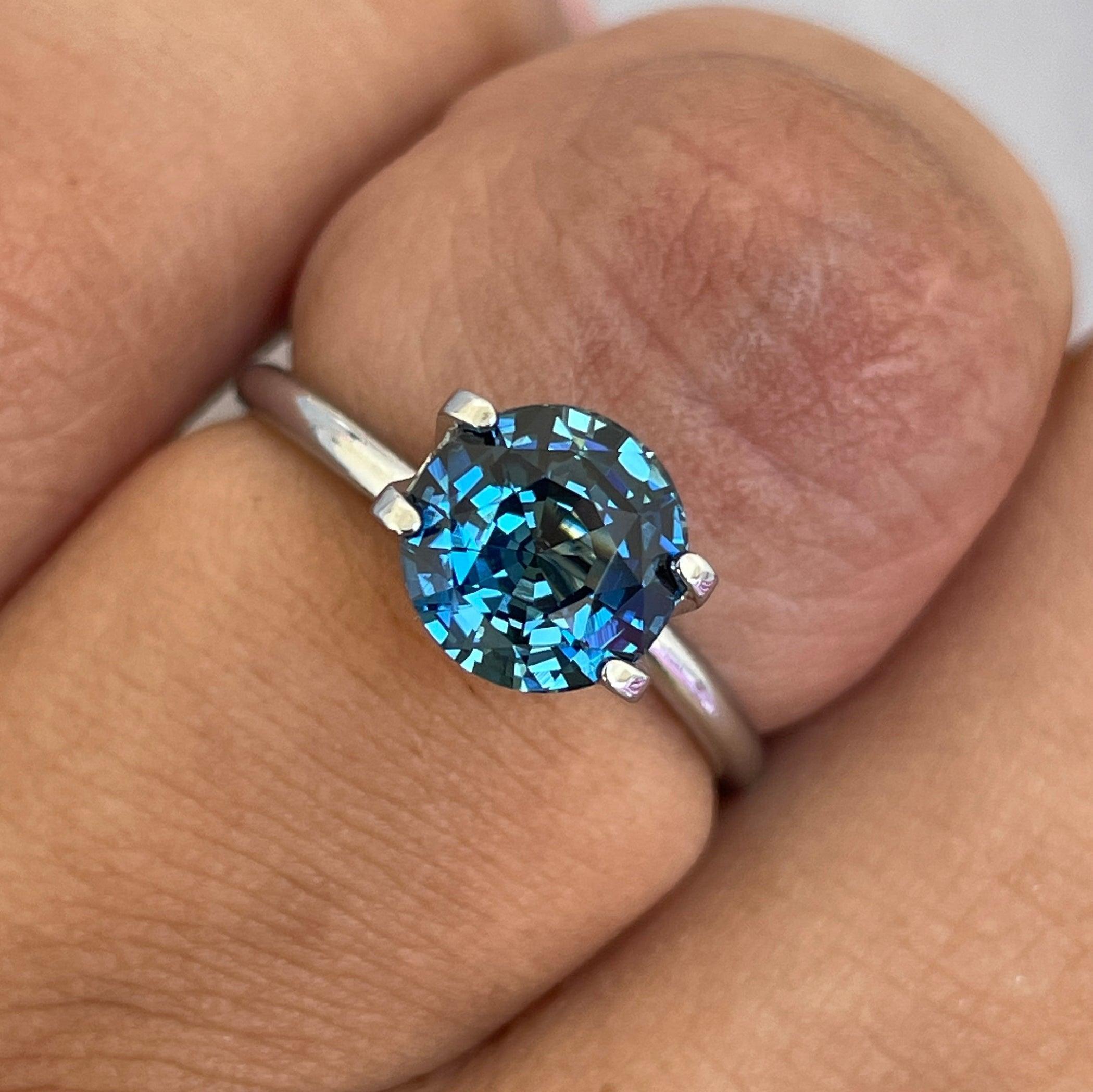 teal blue green parti sapphire round cut gem