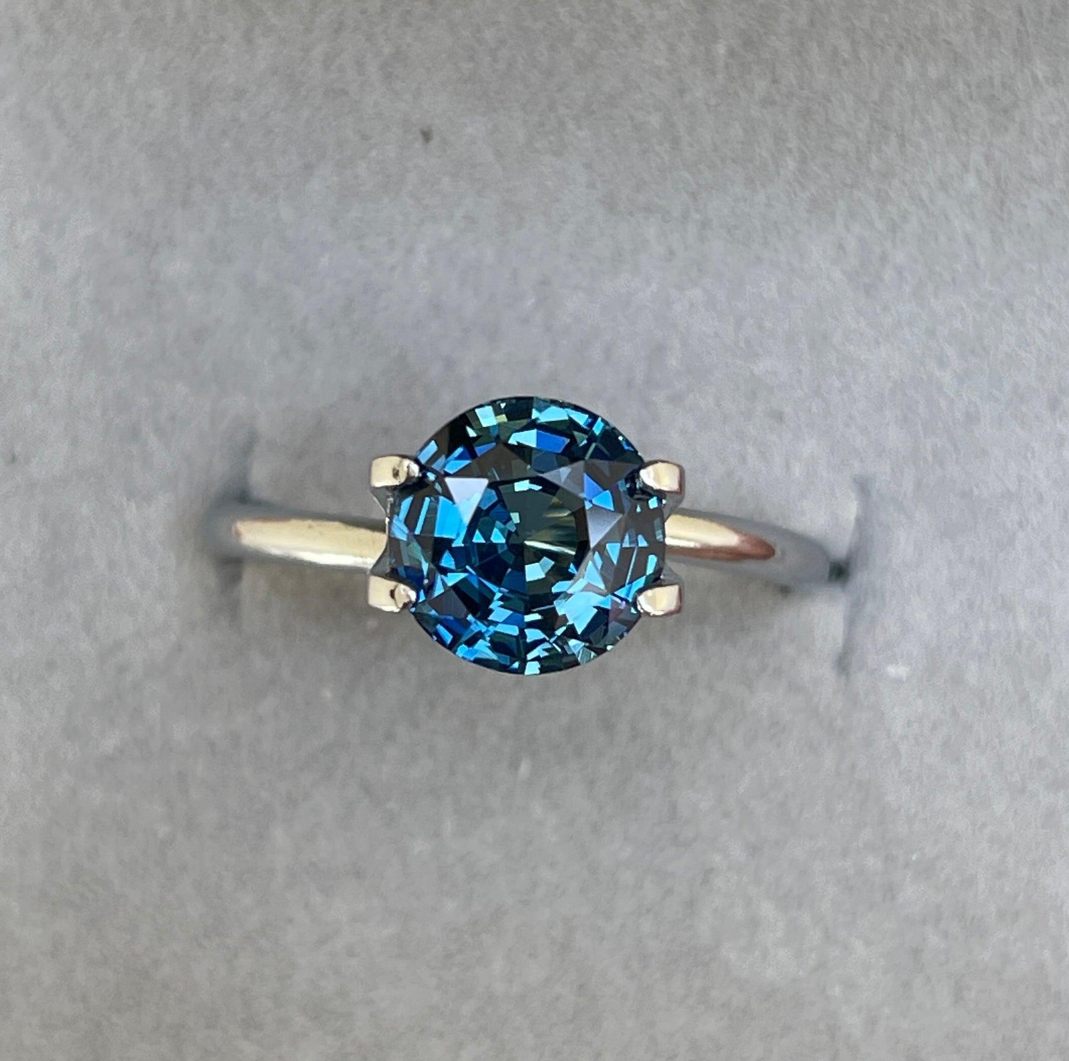 teal blue green parti sapphire round cut gem