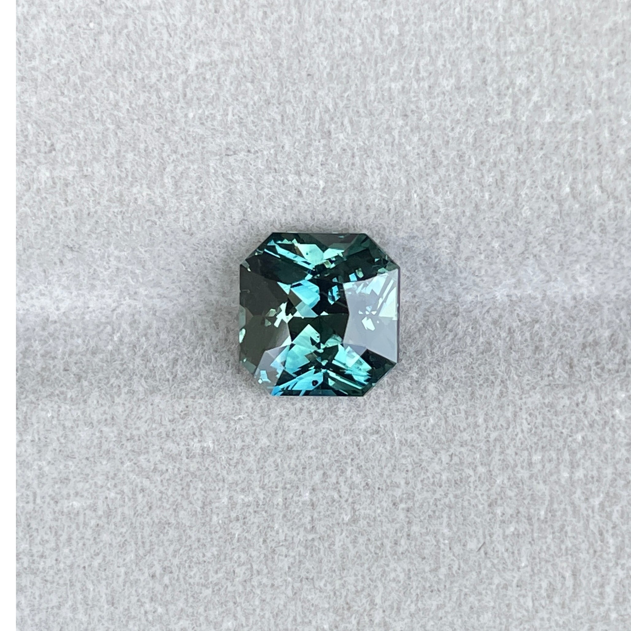 “Loose teal sapphire for custom engagement ring”