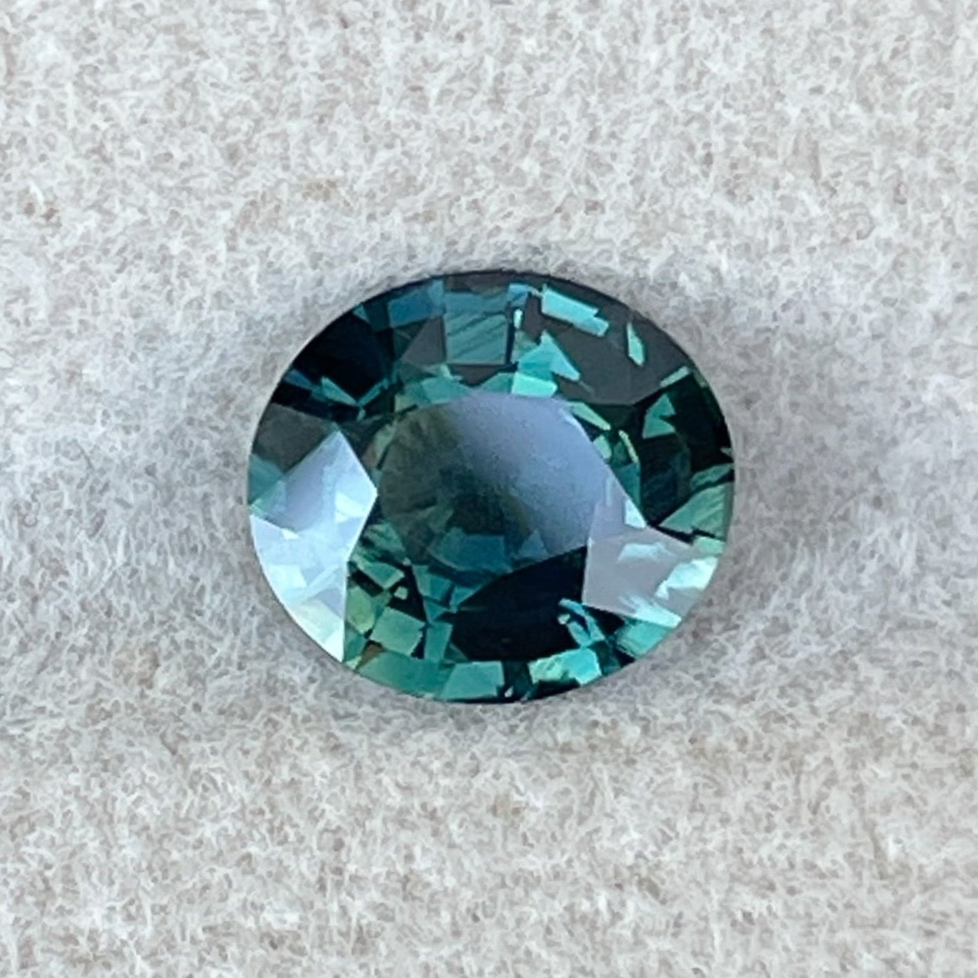 Forest green sapphire, 1.56 Ct oval cut loose teal gemstone by NASHGEMS, ideal for engagement rings or custom jewelry.