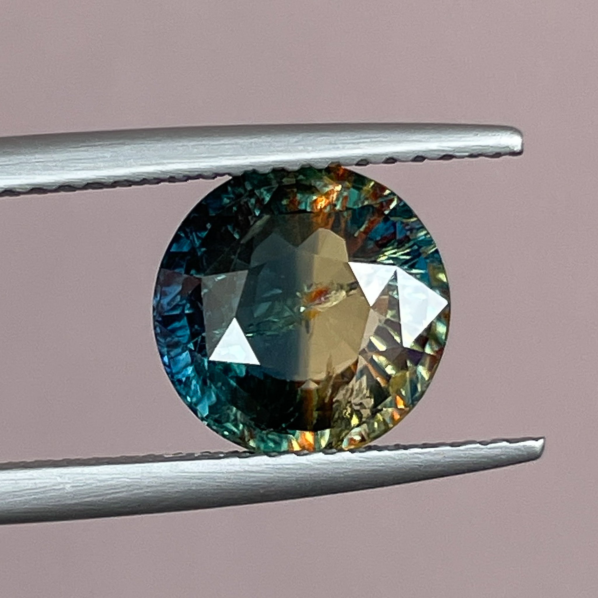 Teal bi-color sapphire, 3.70 Ct round cut loose gemstone from NASHGEMS, ideal for engagement rings or custom jewelry designs.