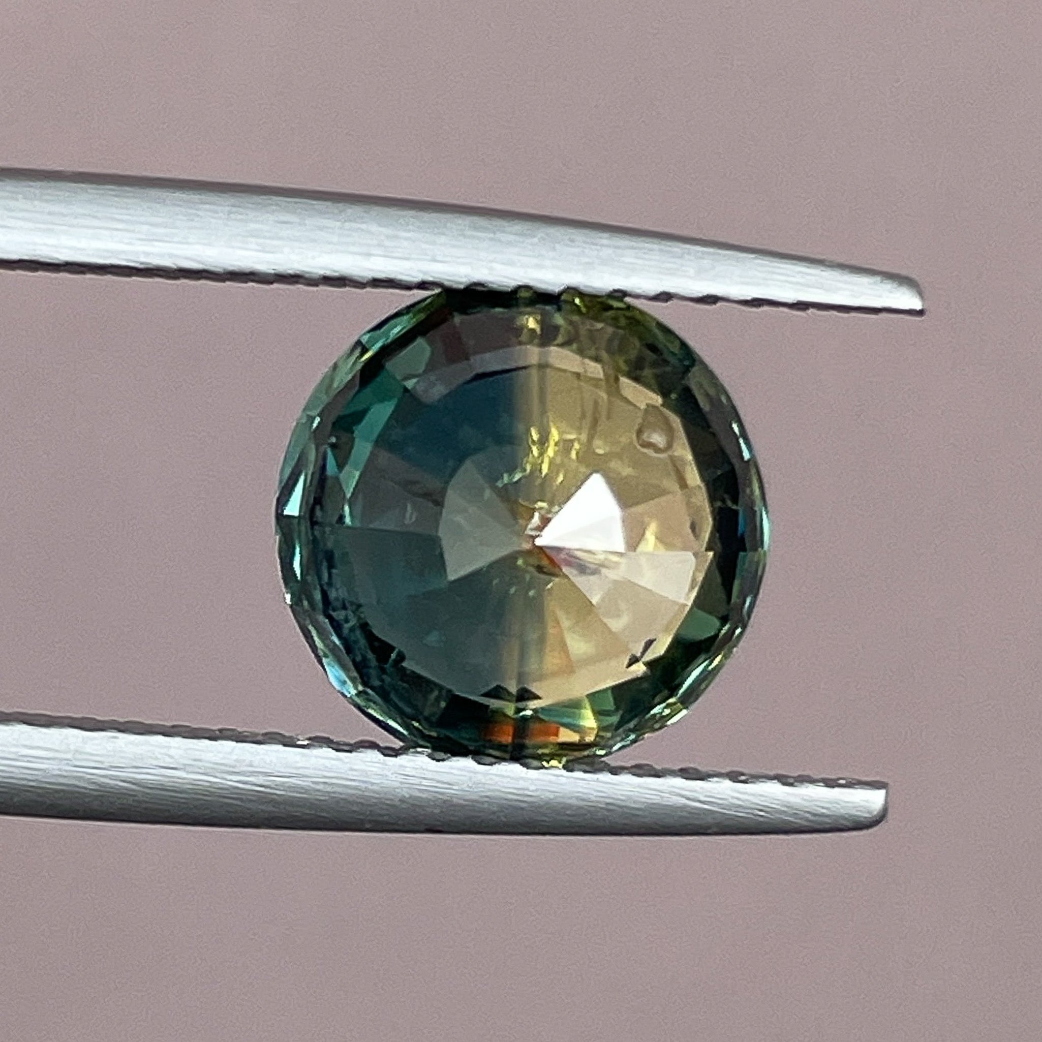 Teal natural bi-color sapphire, 3.70 ct round cut loose gemstone by NASHGEMS, ideal for engagement rings or custom jewelry designs.