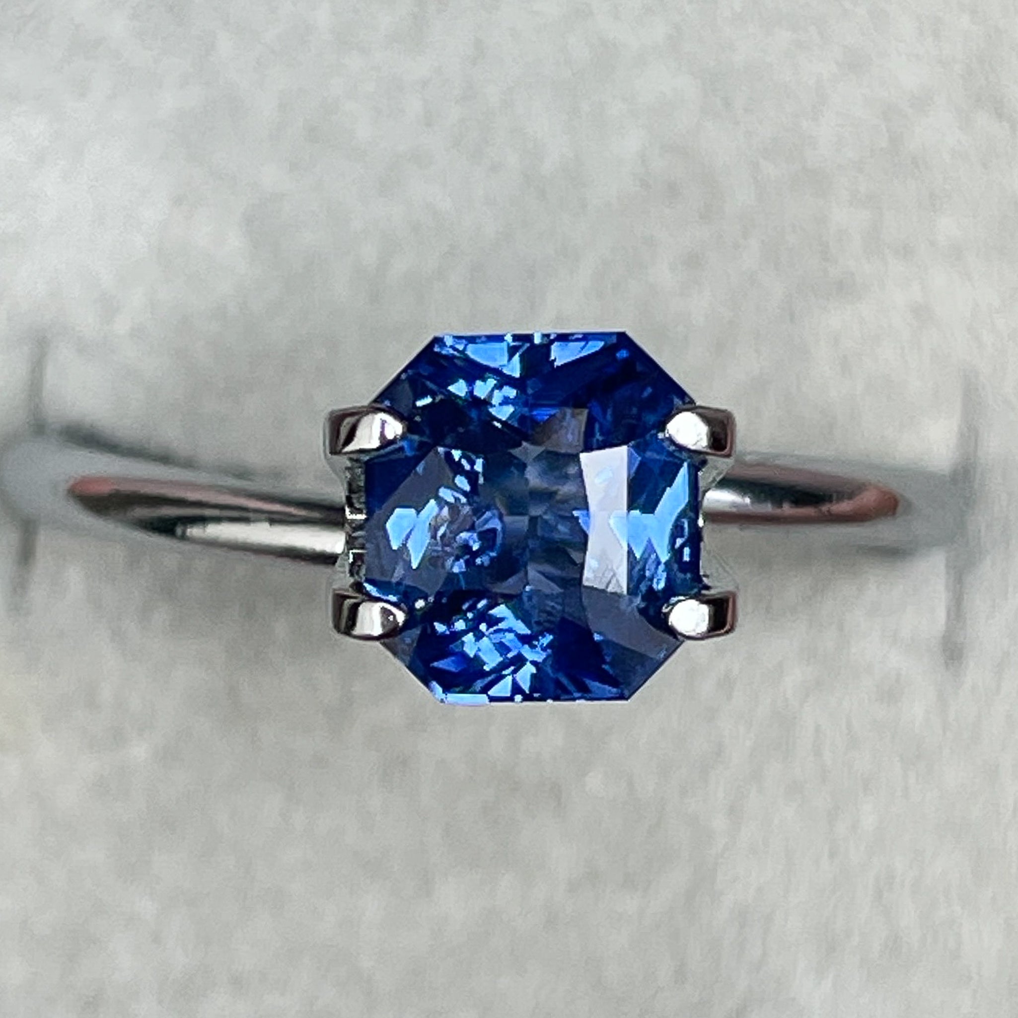 Natural Ceylon Blue Sapphire 1.52 Ct radiant cut by NASHGEMS, vivid blue loose sapphire for engagement or custom jewelry.