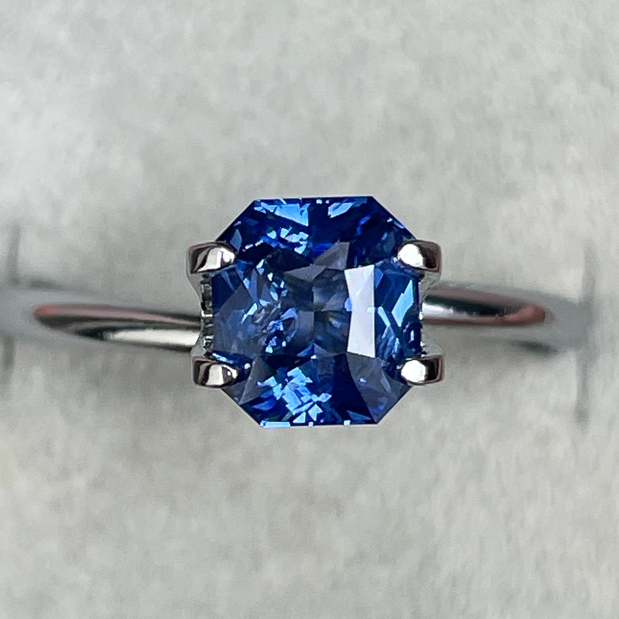 Natural Ceylon Blue Sapphire 1.52 Ct radiant cut by NASHGEMS, vivid blue loose sapphire for engagement or custom jewelry.