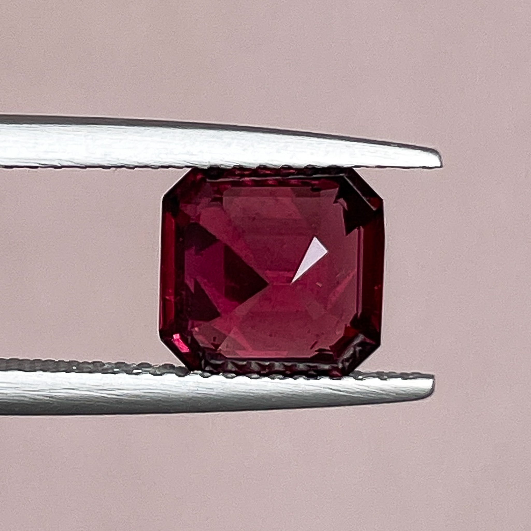 Natural Pyrope Almandite Garnet 3.12 Ct emerald cut loose gemstone in deep red for jewelry or engagement rings.