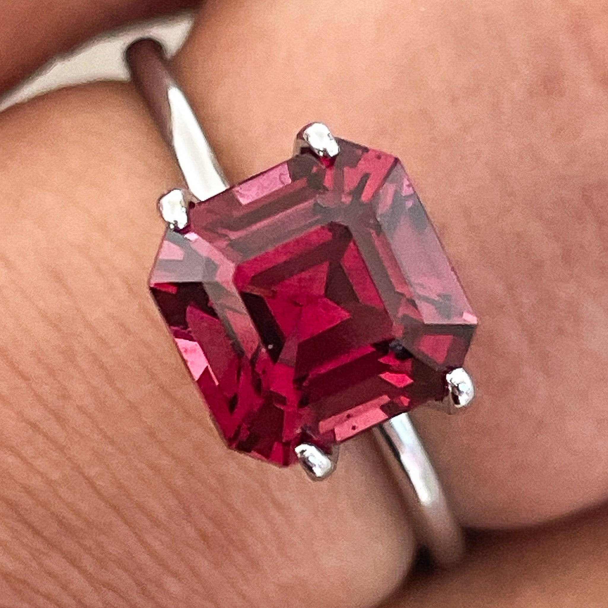Deep red 3.12 ct natural Pyrope Almandite Garnet loose gemstone in emerald cut, ideal for engagement rings, by NASHGEMS.