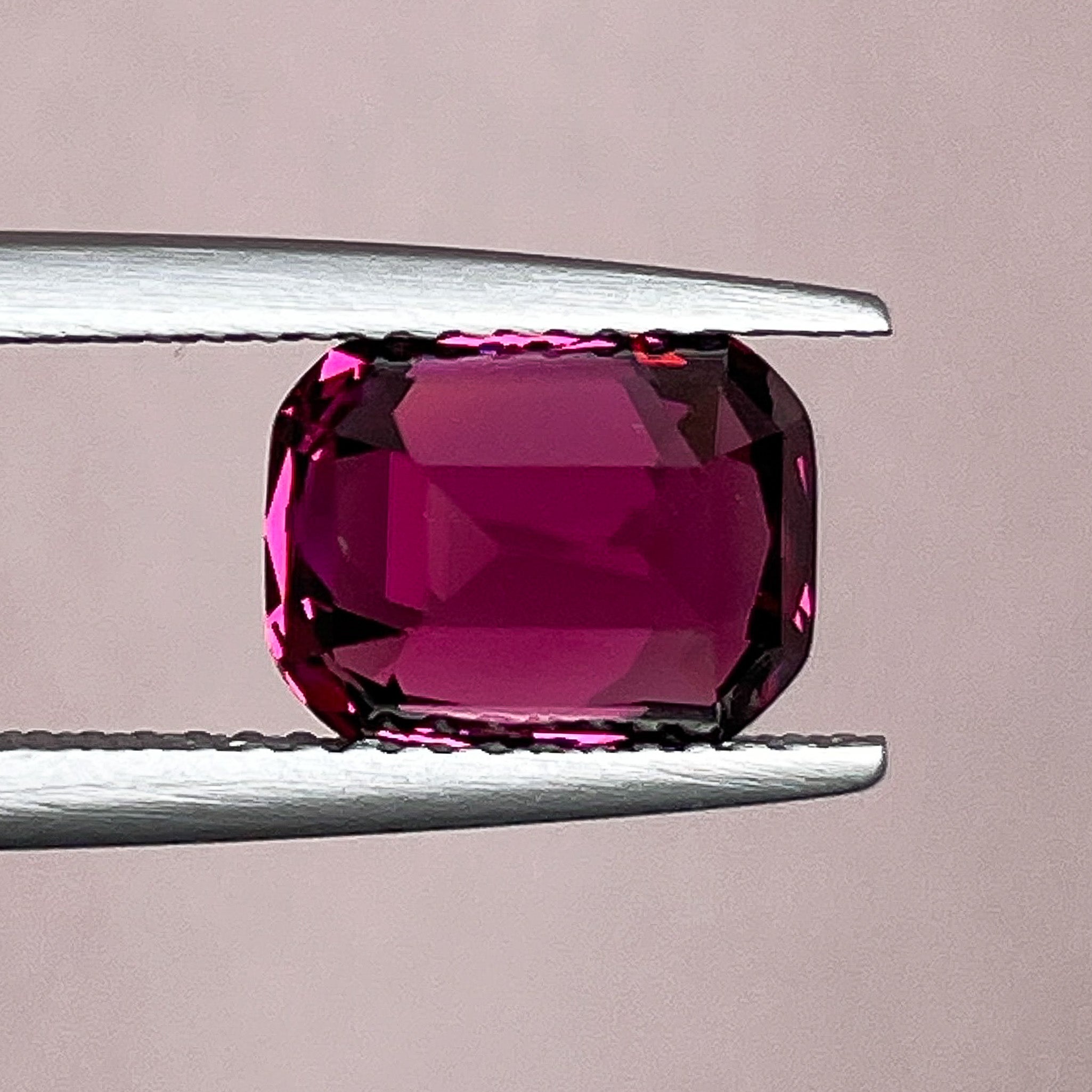 Natural Rhodolite Garnet 3.39 Ct cushion cut gemstone with raspberry red color, loose VVS clarity, ideal for engagement rings.