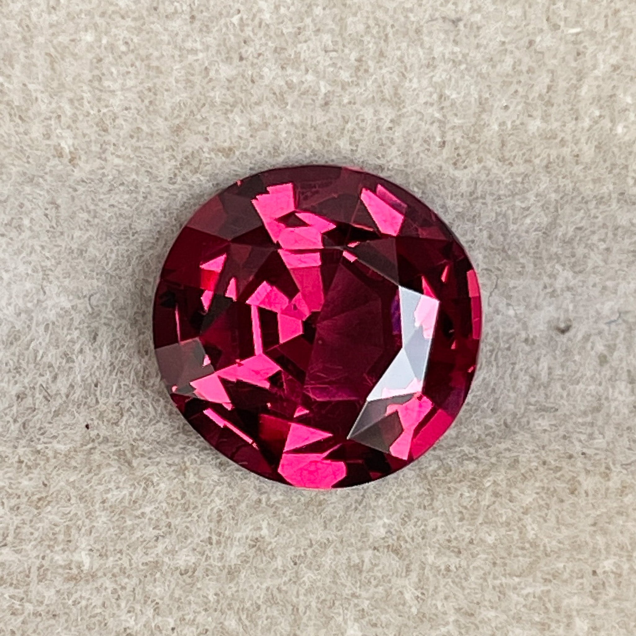 Natural Rhodolite Garnet 3.13 Ct round cut gemstone with raspberry red color, VVS clarity, suitable for engagement jewelry.
