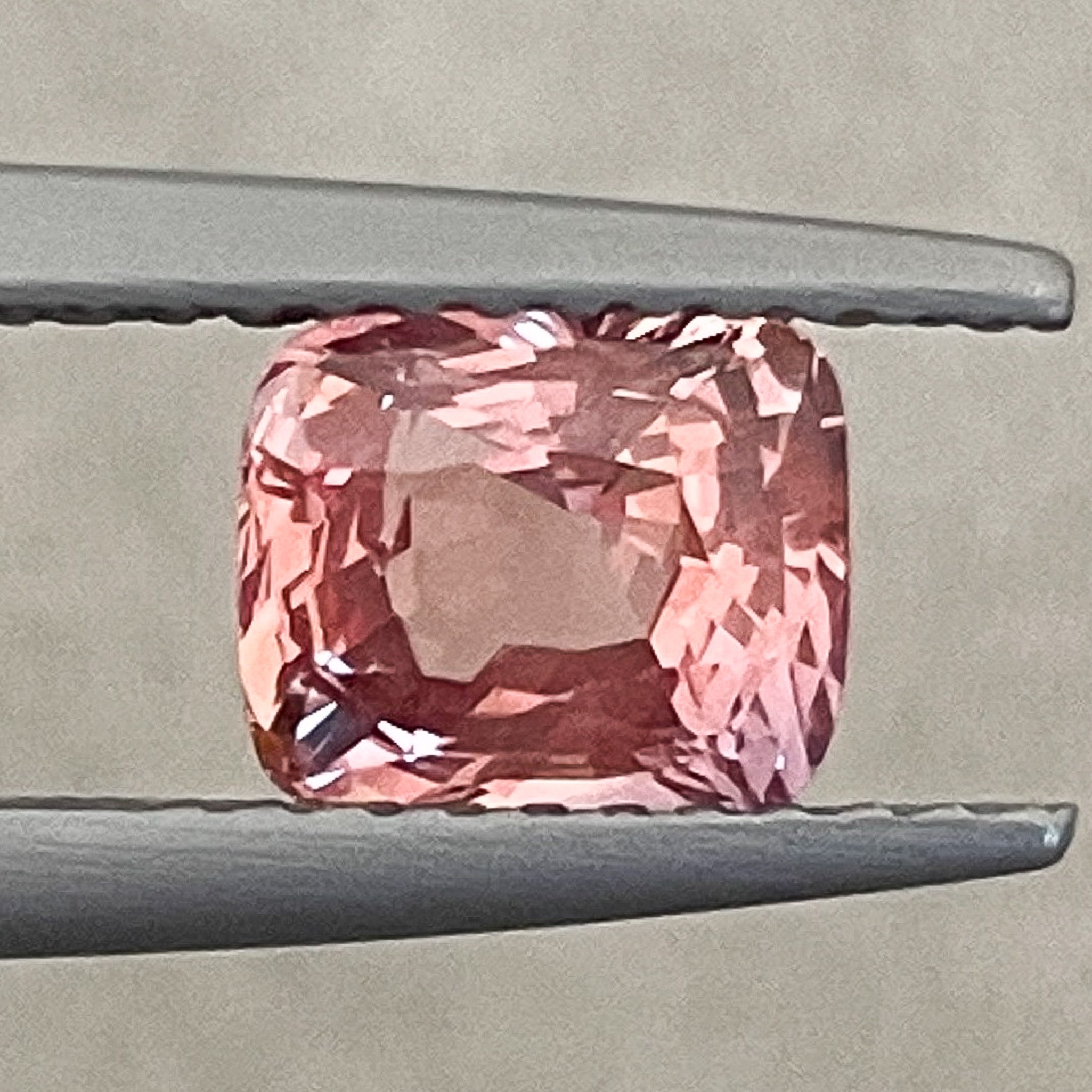 Natural Padparadscha Sapphire 1.55 Ct cushion cut loose gemstone from NASHGEMS, vibrant no heat sapphire for engagement jewelry.
