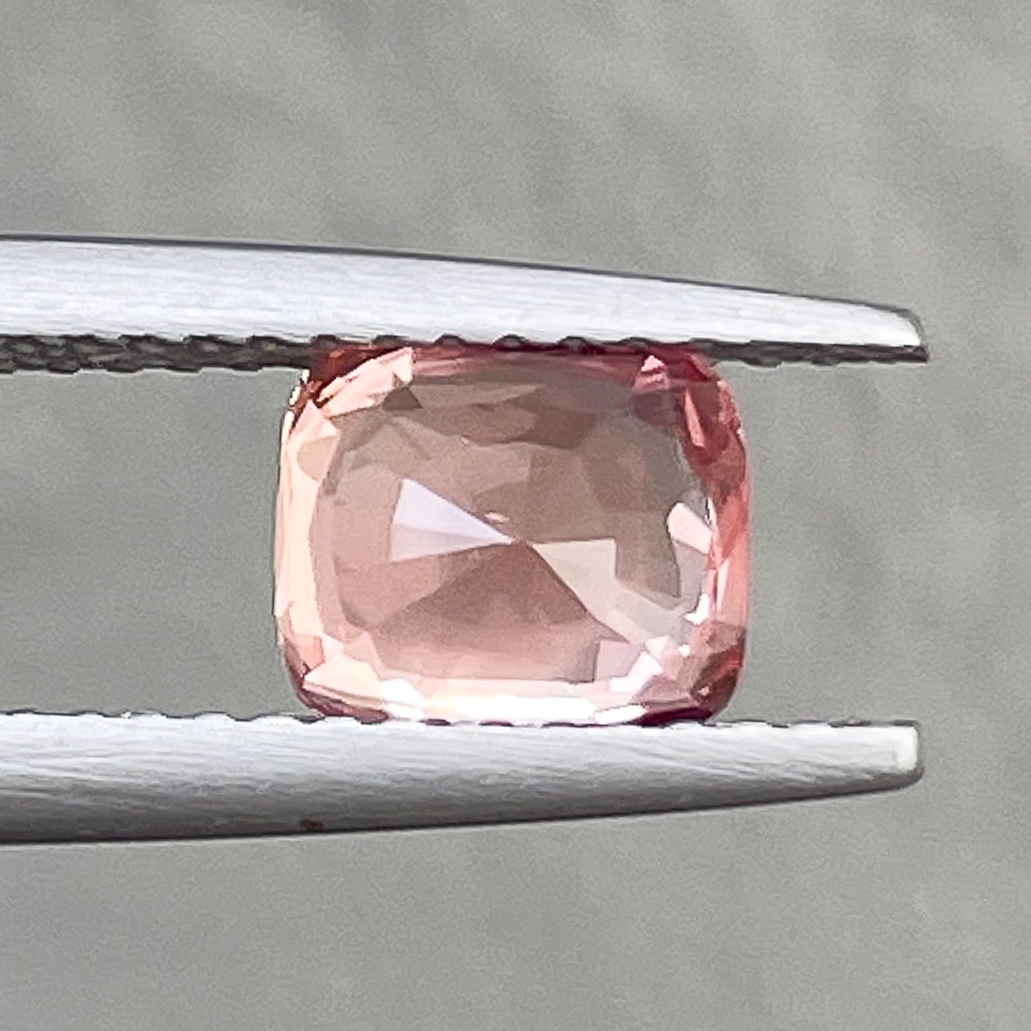 Natural Padparadscha sapphire loose gemstone, 1.55 Ct cushion cut, no heat, vibrant orange-pink color for engagement rings.