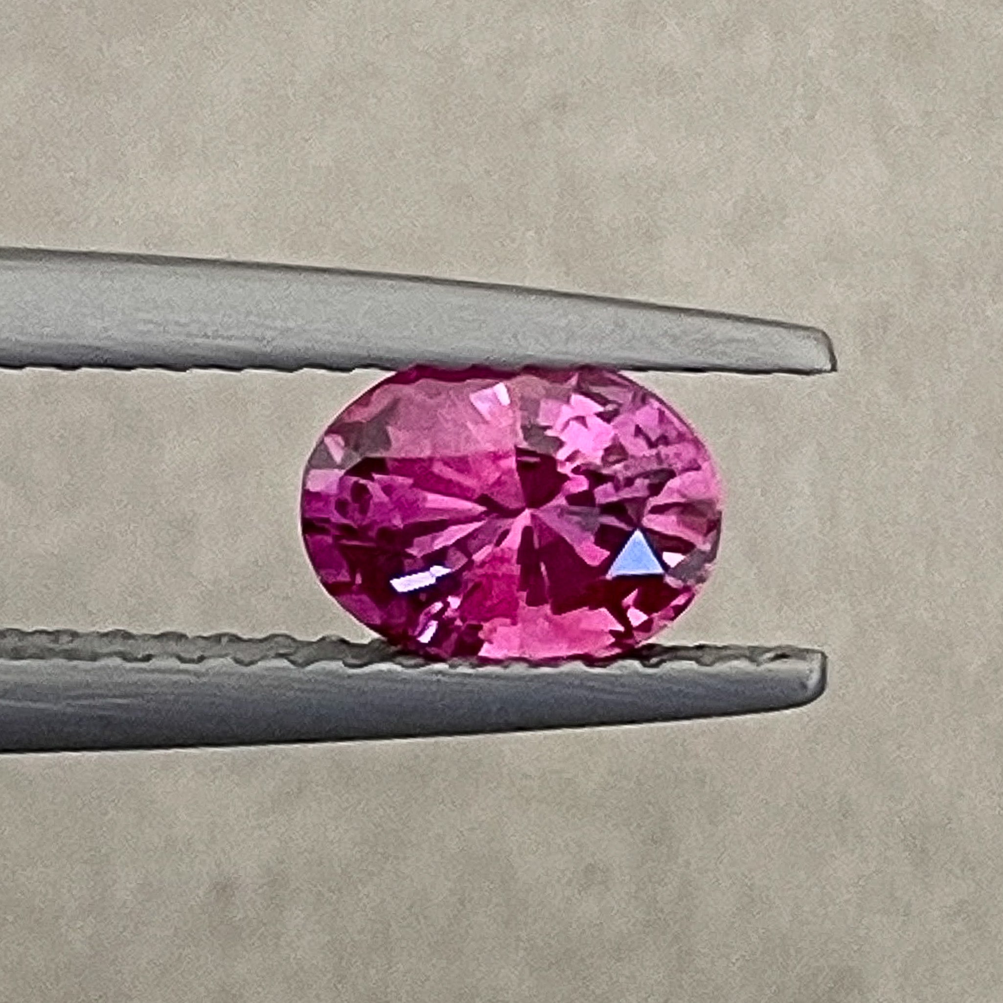 Natural pink sapphire loose gemstone, 1.00 Ct oval cut, heat treated, from NASHGEMS, ideal for engagement rings.