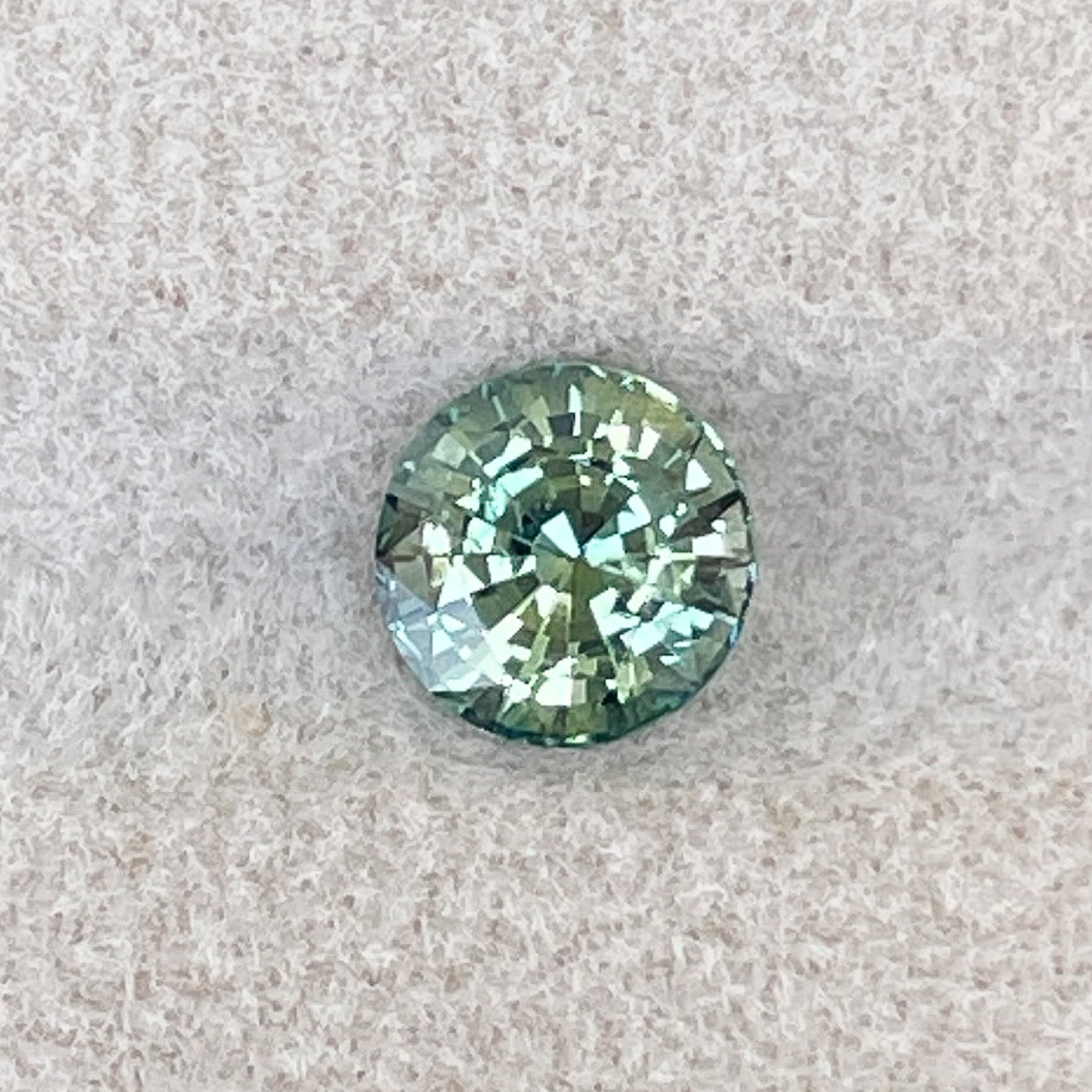 Natural green teal sapphire loose gemstone, 1.50 Ct round cut by NASHGEMS, ideal for engagement rings or custom jewelry.