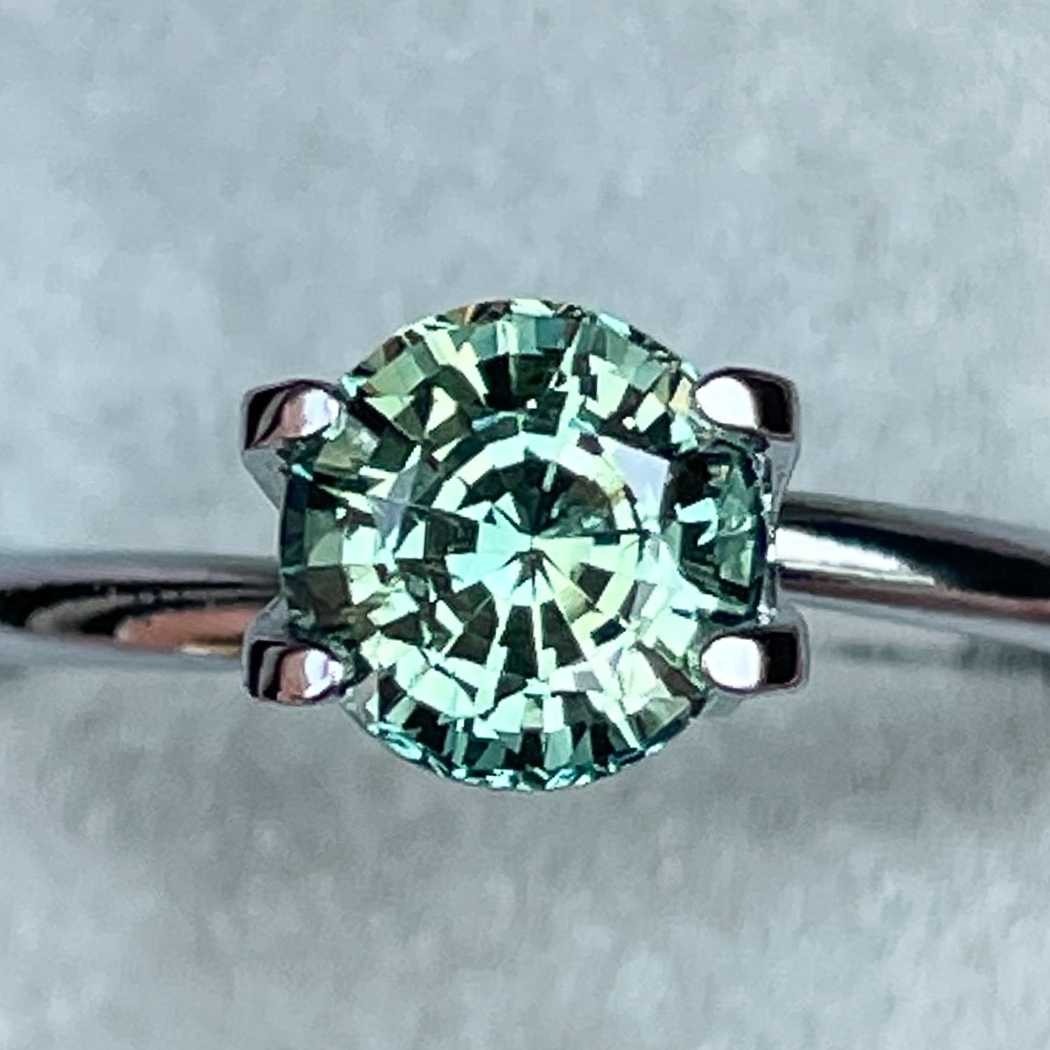 Natural green teal sapphire loose gemstone, 1.50 Ct round cut by NASHGEMS, perfect for engagement rings or custom jewelry.