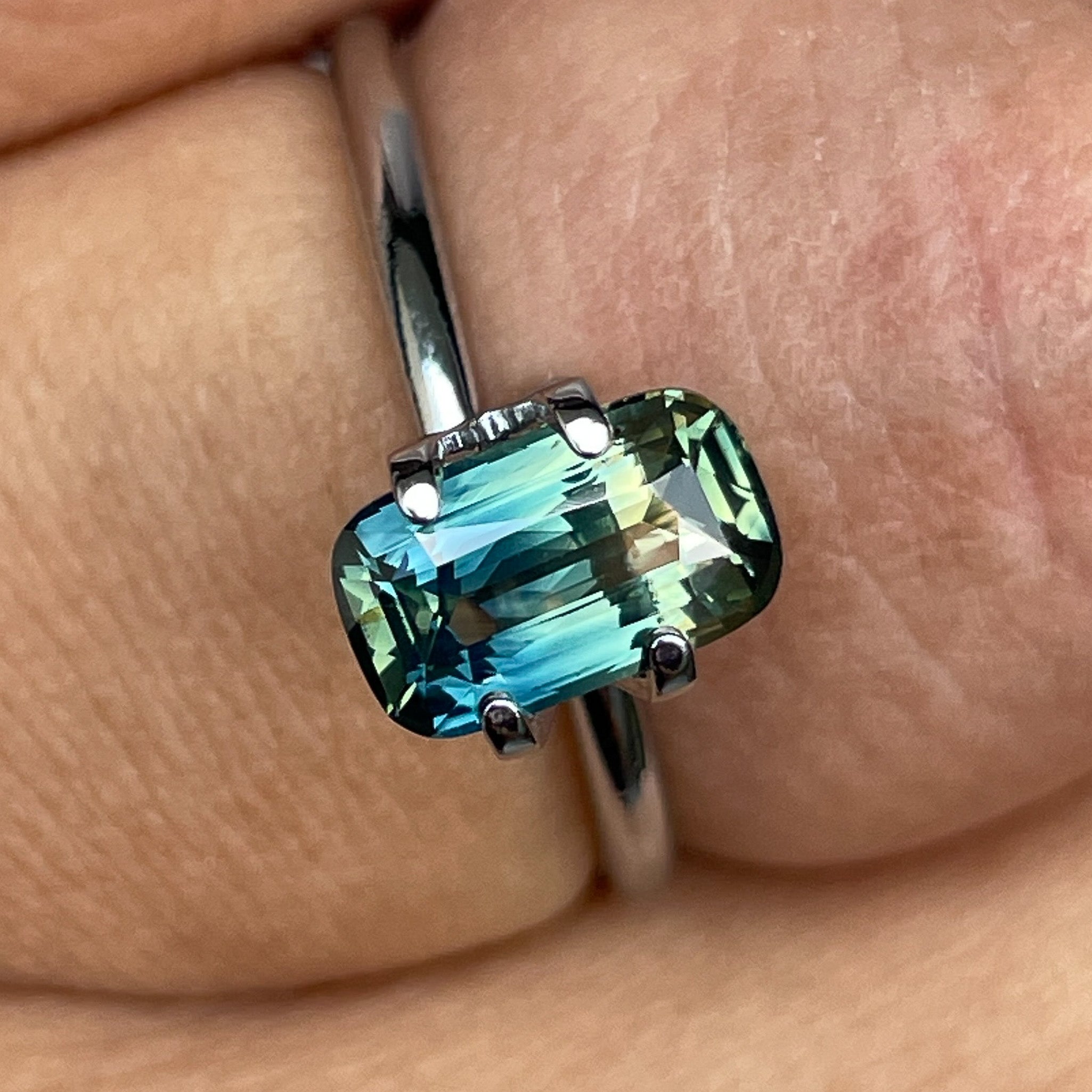Teal natural parti bi-color sapphire 1.55 Ct cushion cut loose gemstone by NASHGEMS for engagement or custom jewelry.