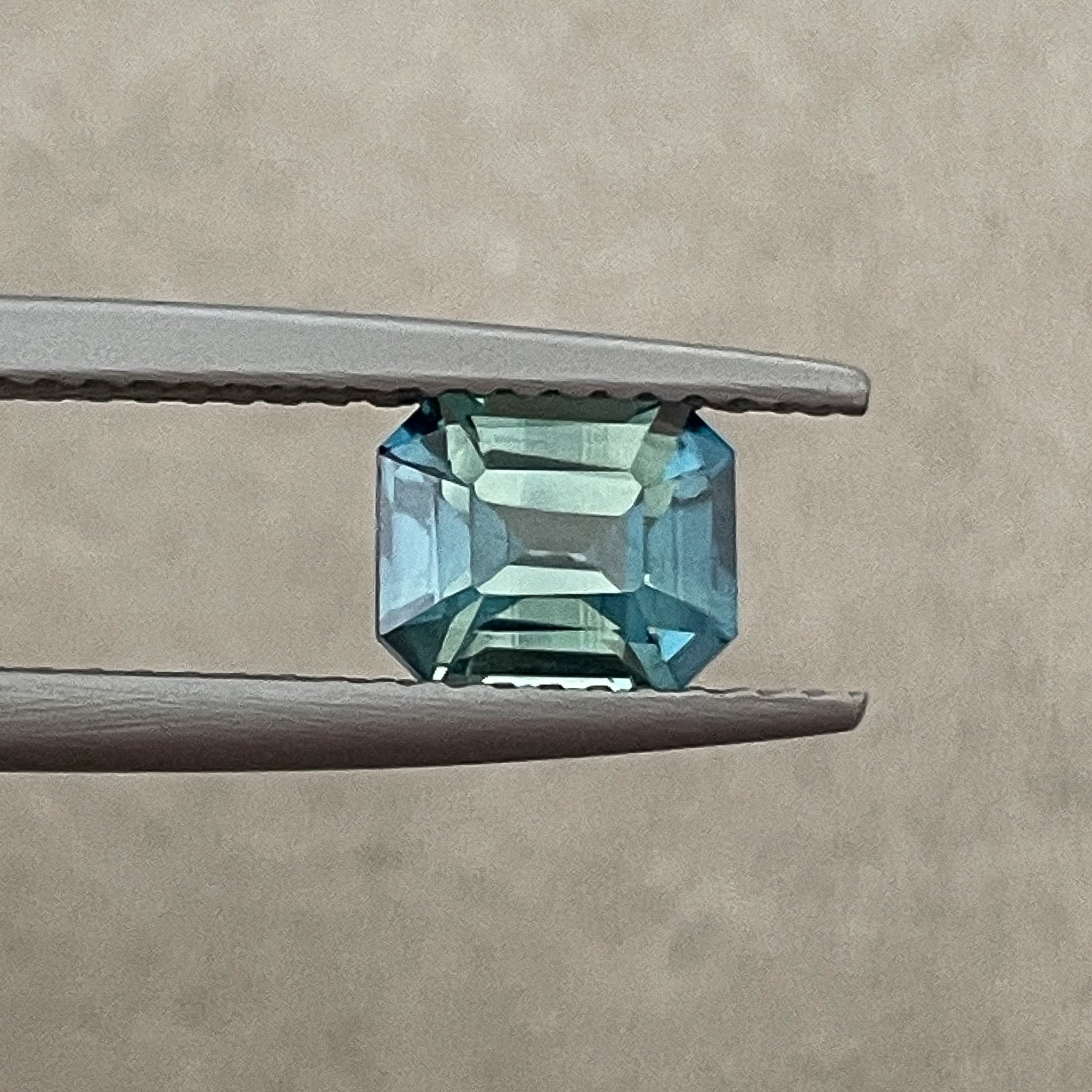 Natural teal blue-green bi-color sapphire 1.38 Ct emerald cut, loose no-heat sapphire from NASHGEMS for engagement jewelry.